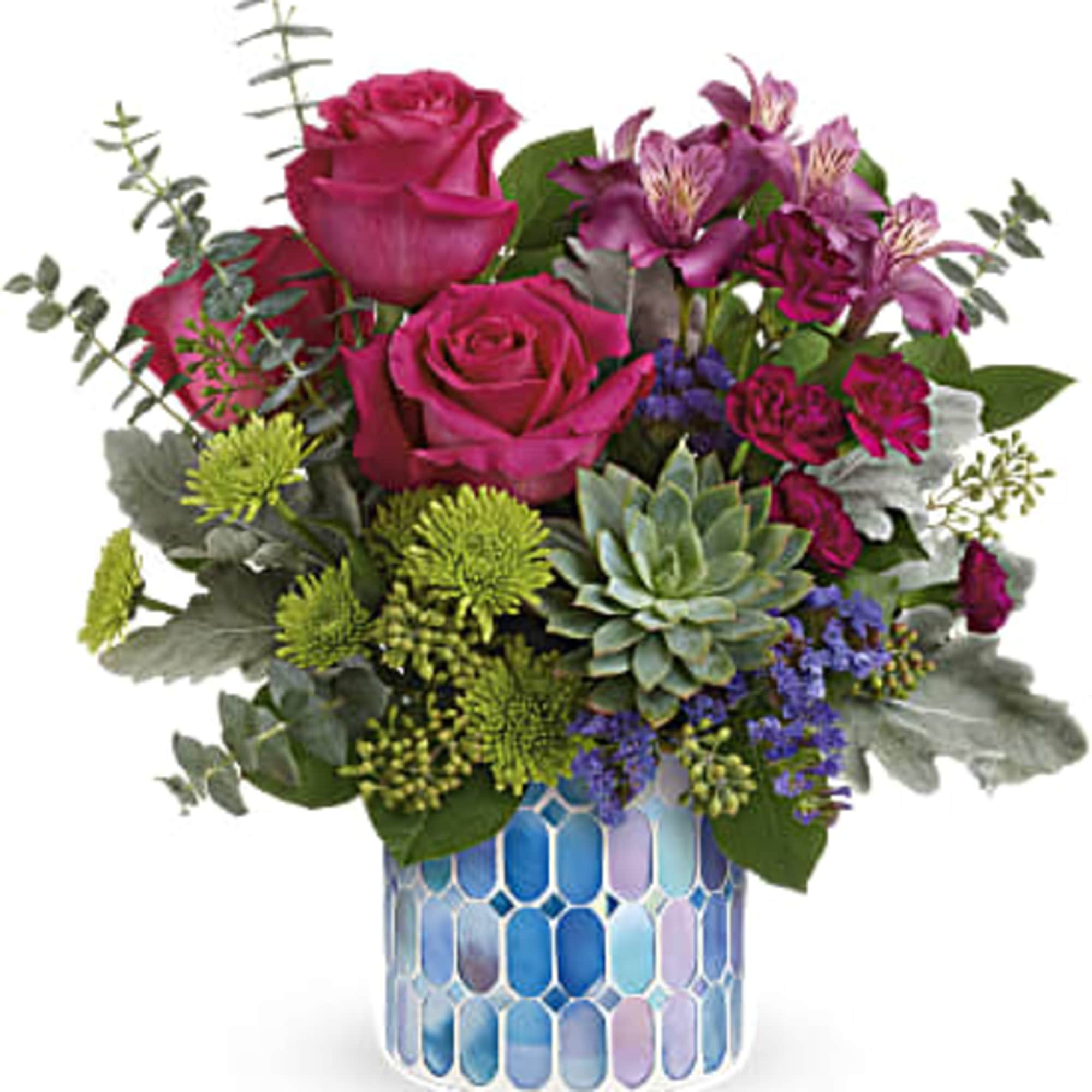 DESCRIPTION
VASE
SIZES
Presented in a shimmering mosaic vase of blue stained glass, this cheerful