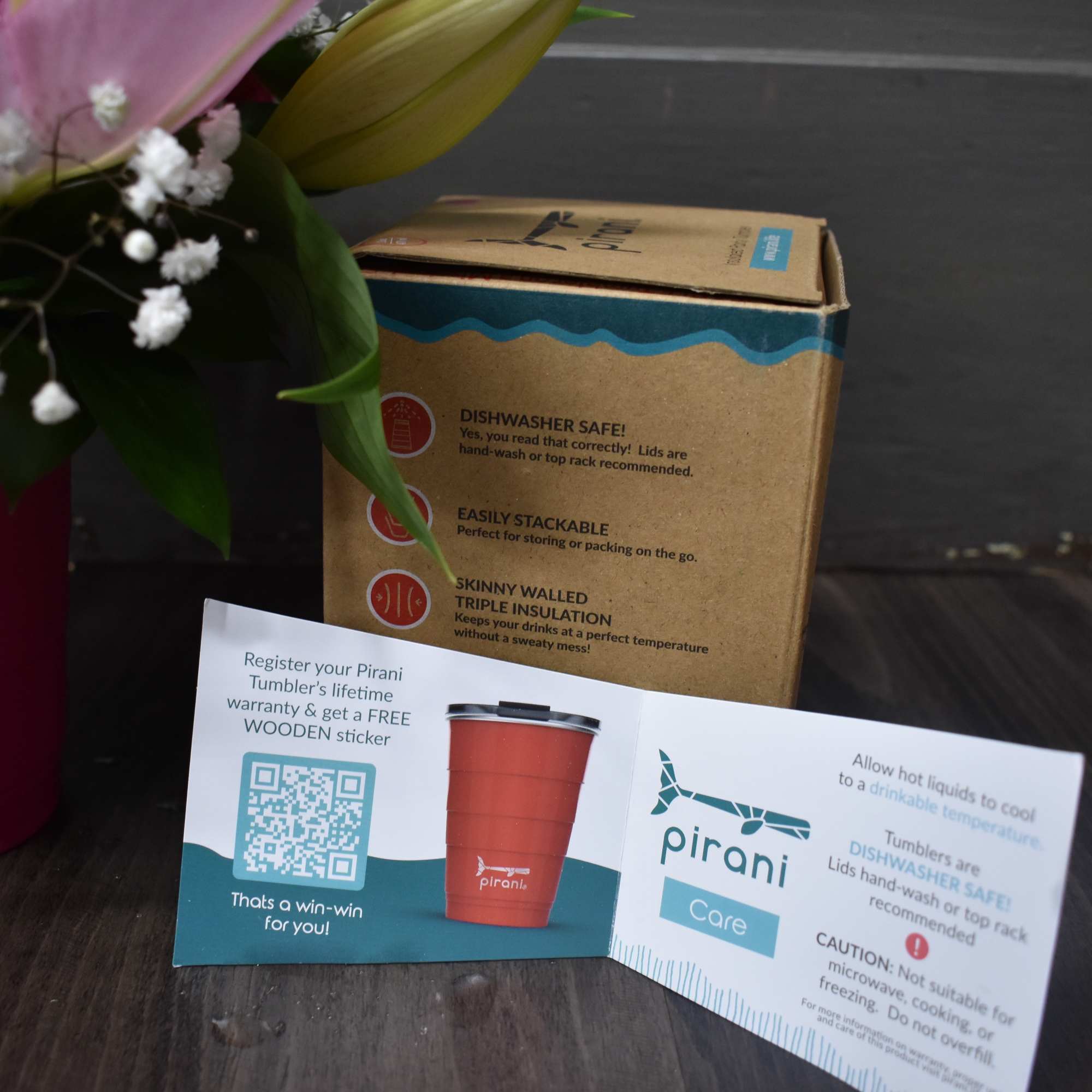 A refreshing bouquet of flowers in an insulated party tumbler By Pirani. A refreshing bouquet of flowers in an insulated party tumbler By Pirani.