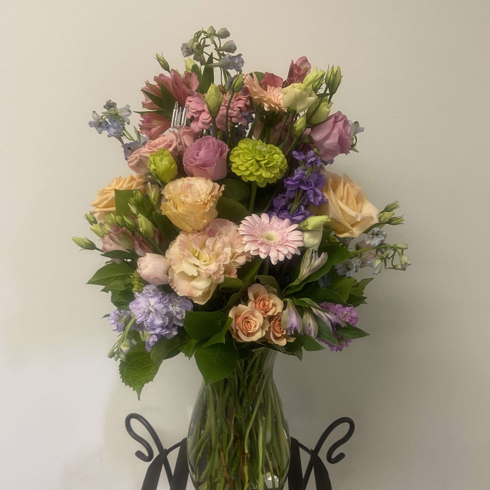 A classic large Jordan style vase filled with Designer's choice PASTEL blooms A classic large Jordan style vase filled with Designer's choice PASTEL blooms
