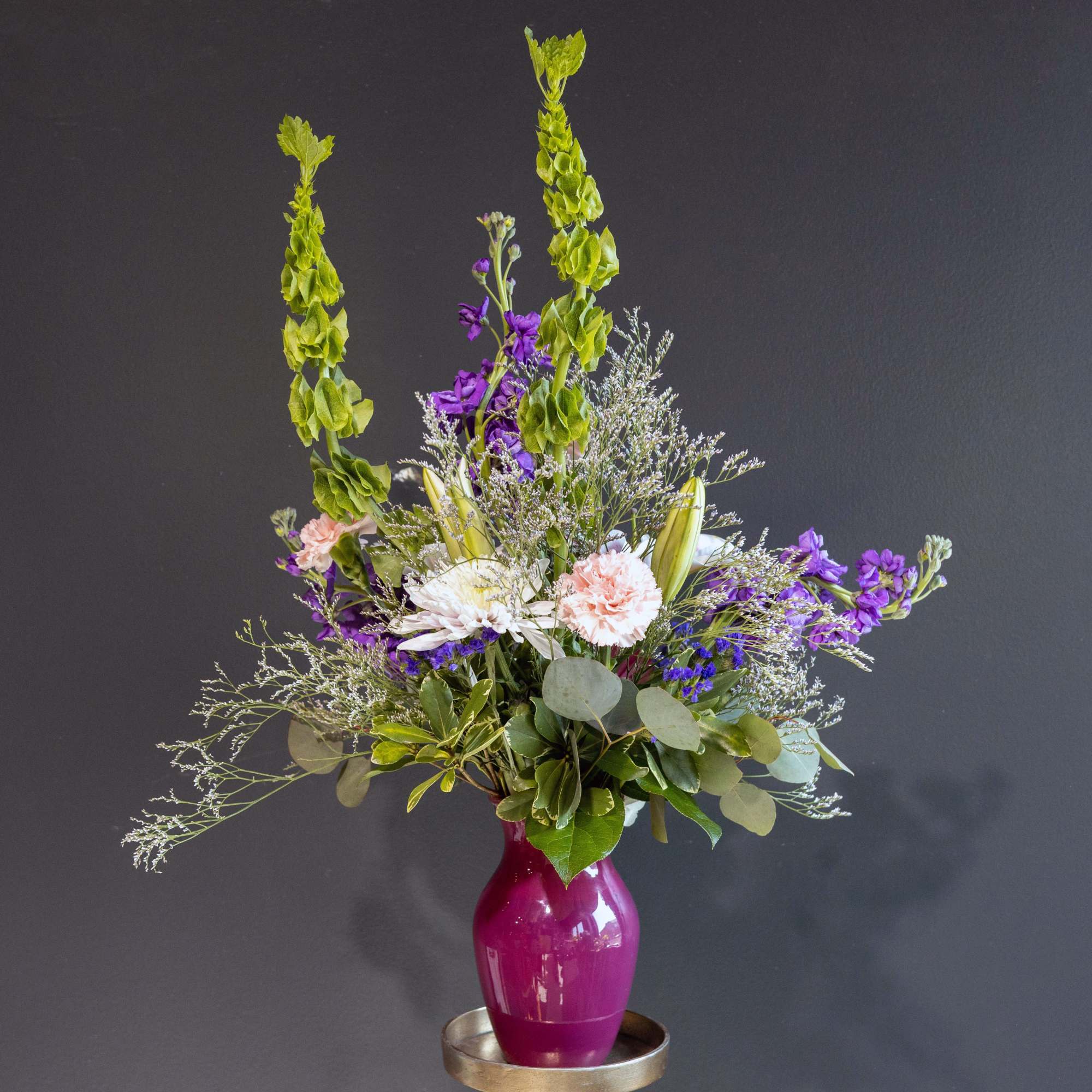 This bold and spirited arrangement with a beautiful combination of Gerbera Daisies