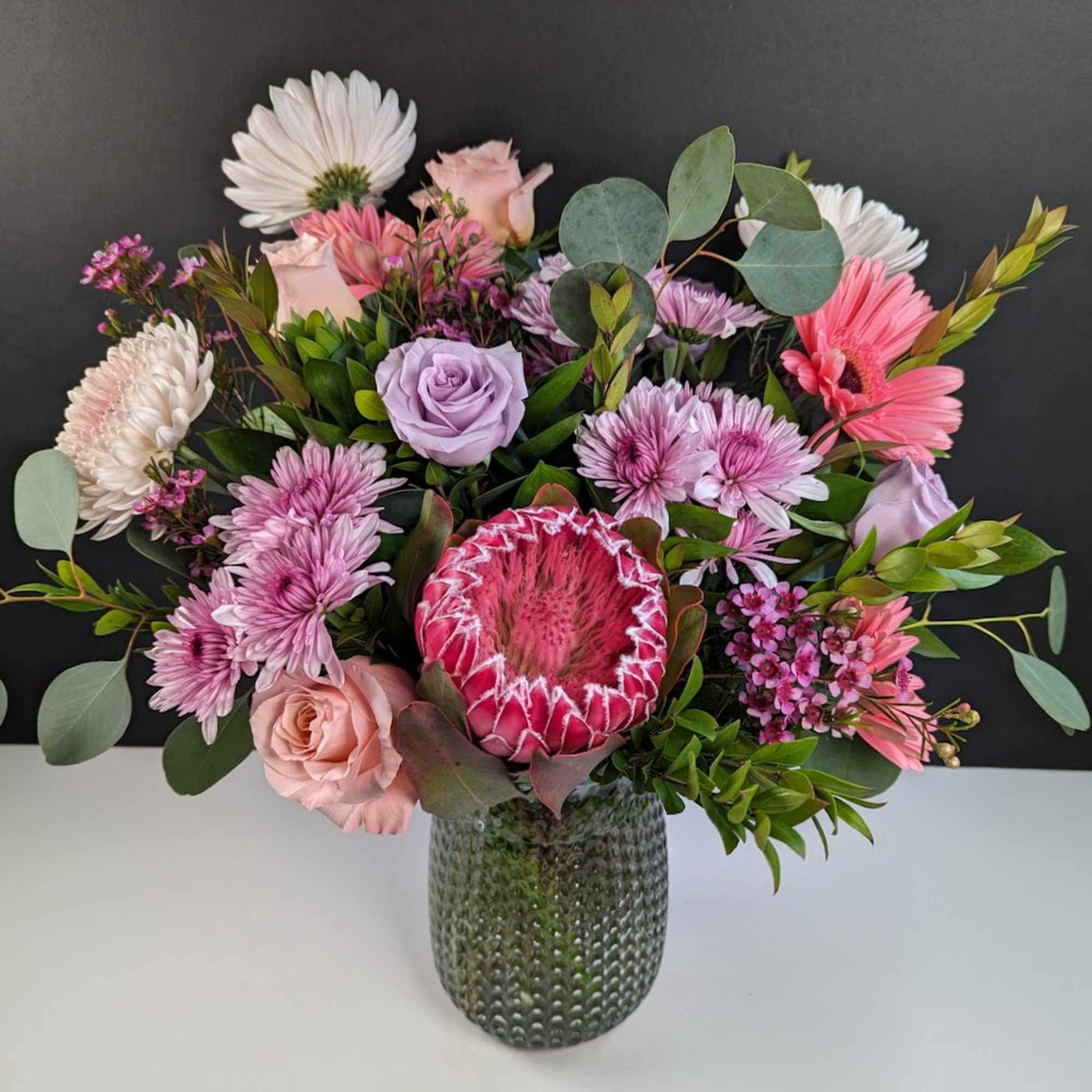 Explore the Elegance of Mauve Blooms Floral Arrangement
Mauve Blooms showcases the soft Explore the Elegance of Mauve Blooms Floral Arrangement
Mauve Blooms showcases the soft