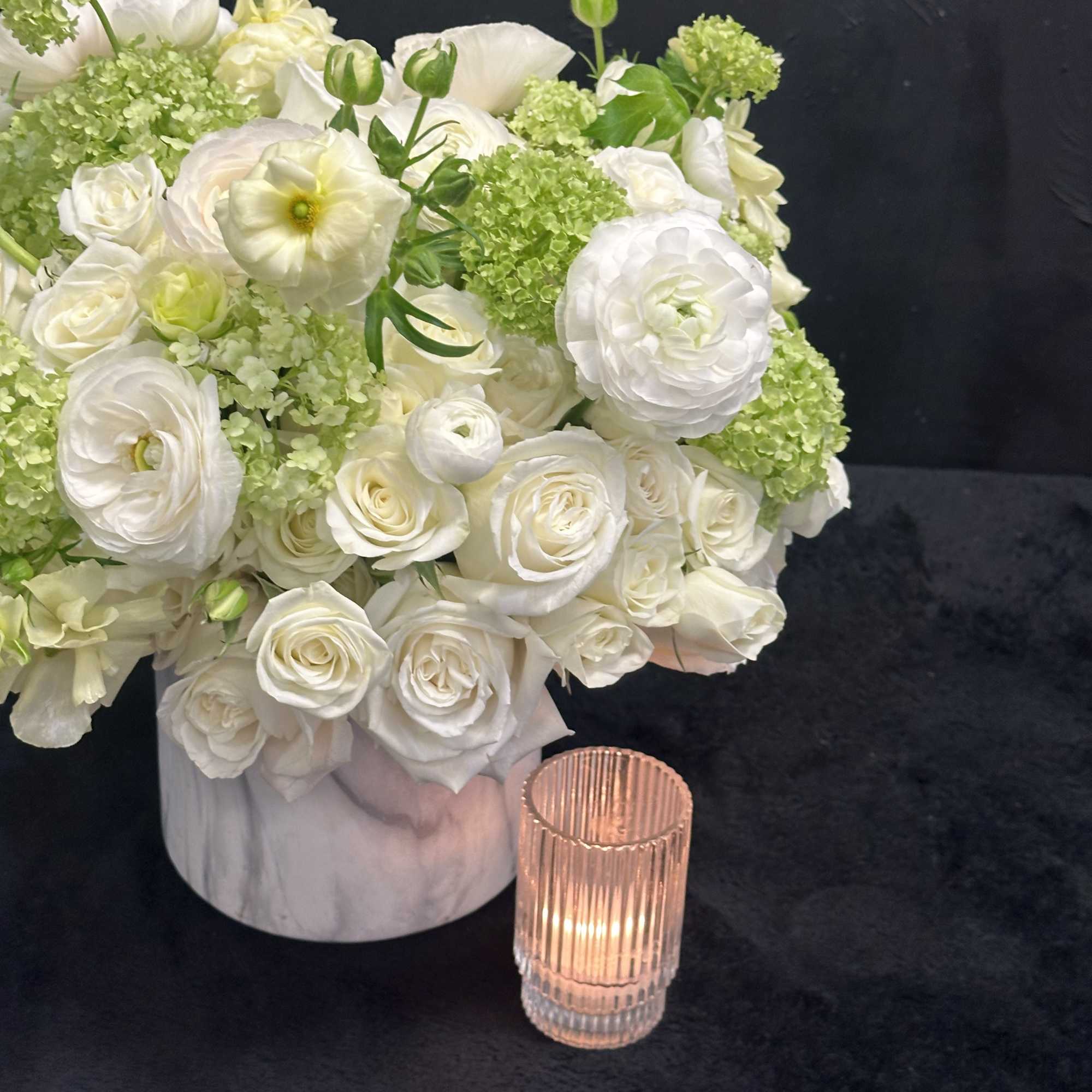 Tranquil Meadows arrangement combines the timeless elegance of white roses, spray roses