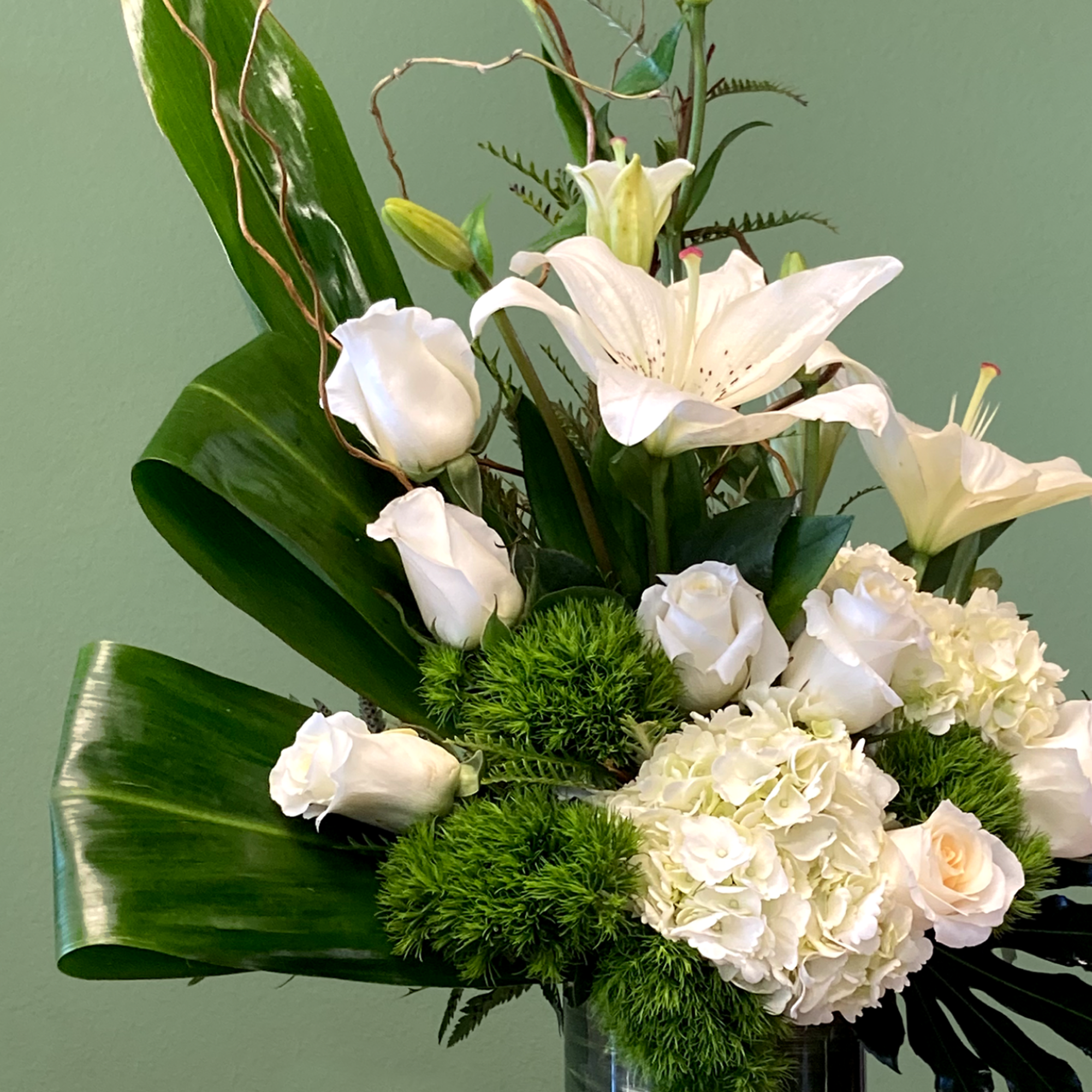 A beautiful botanical sculpture showcasing a bichromatic green and white palette. Featuring