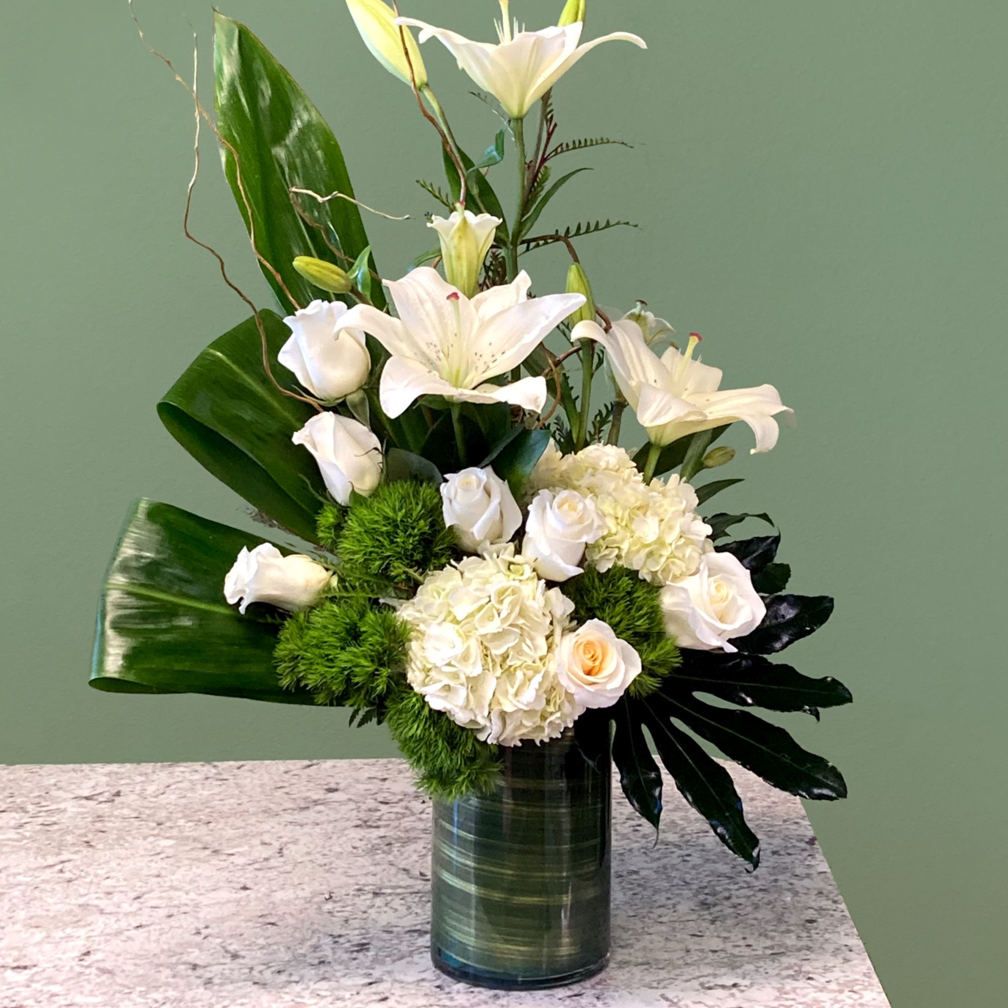 A beautiful botanical sculpture showcasing a bichromatic green and white palette. Featuring
