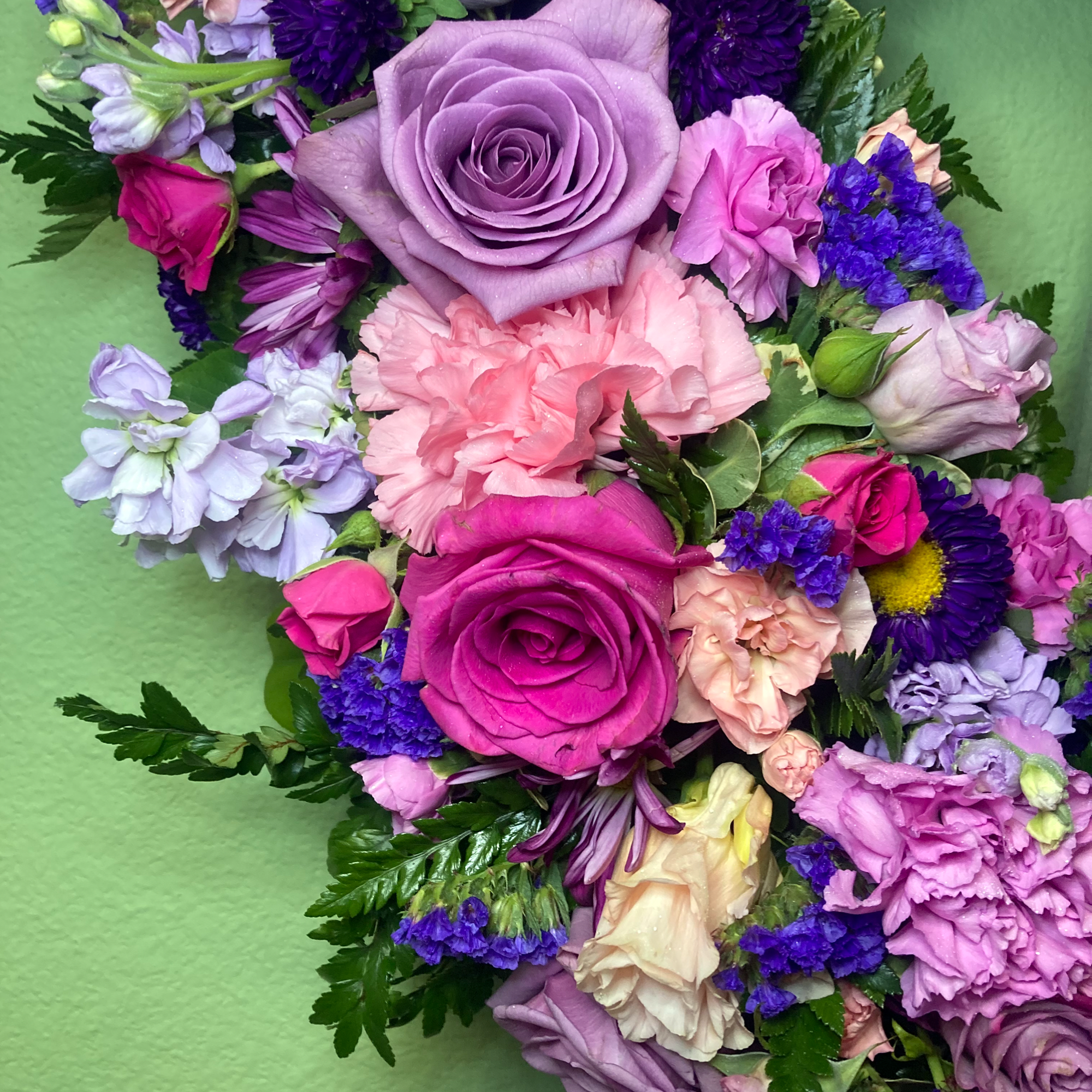 Lavender Tribute is a tranquil Standing Wreath of flowers that arrives delivered