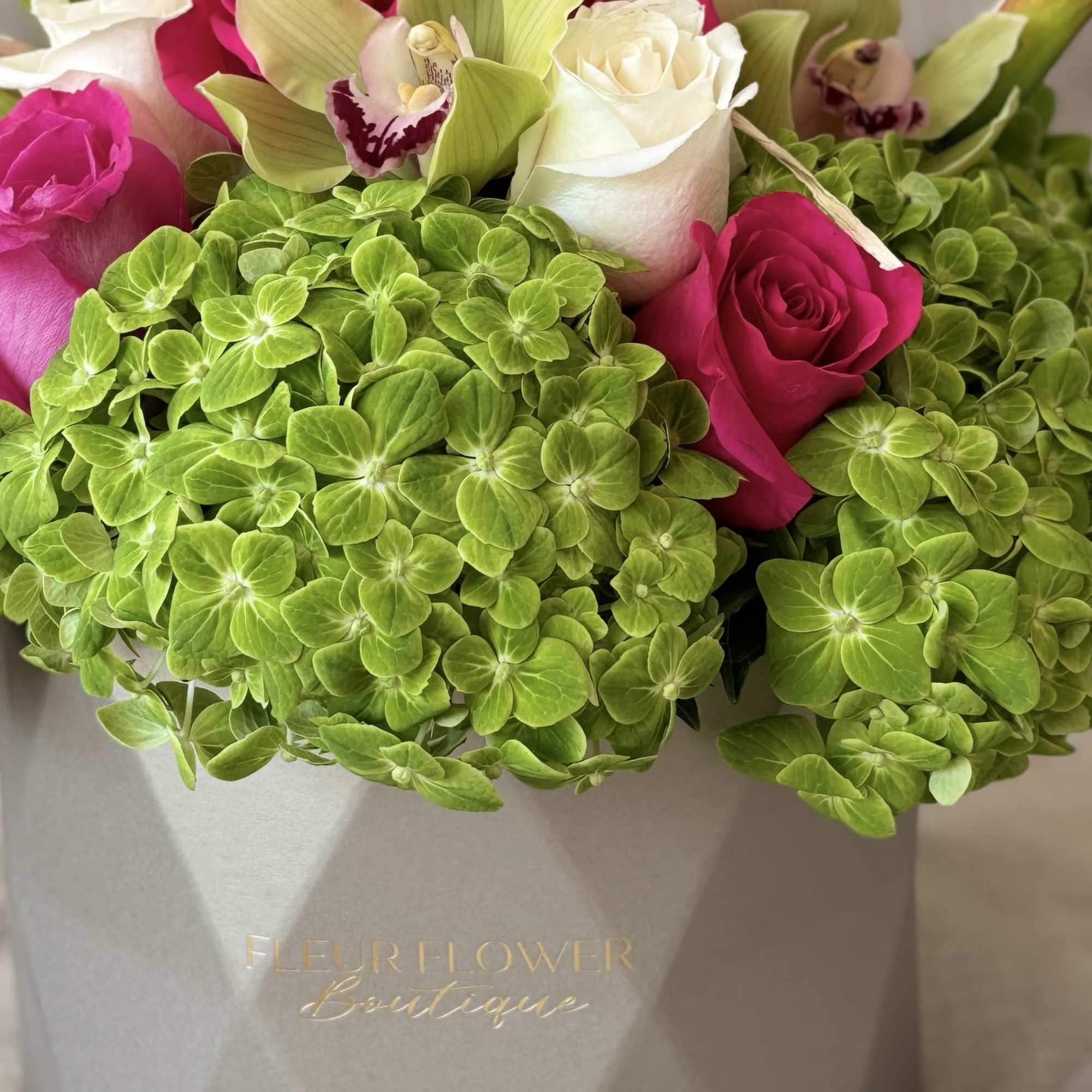 Serena is a striking floral arrangement that includes vibrant&amp;nbsp; orchids,calas,&amp;nbsp; white roses