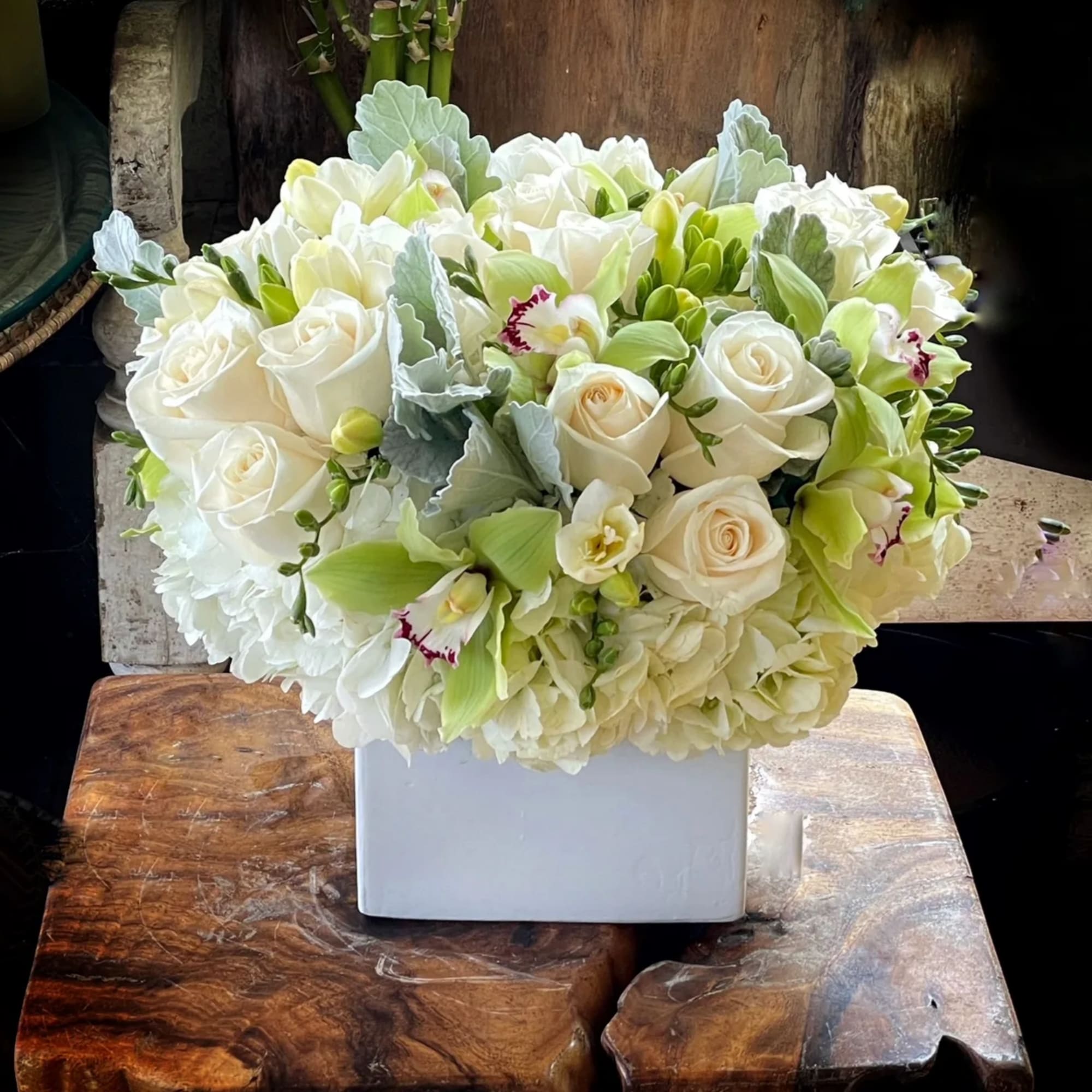 Hydrangeas, White Roses, White Tulips, cymbidium Orchid.