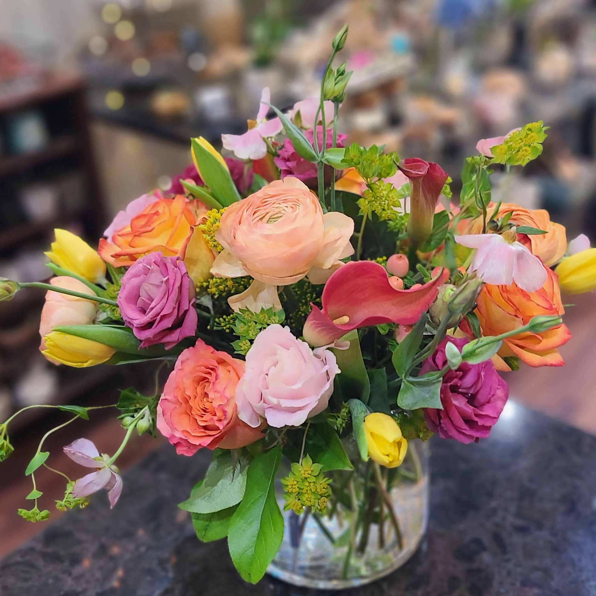 Vibrant flowers shine bright in this arrangement