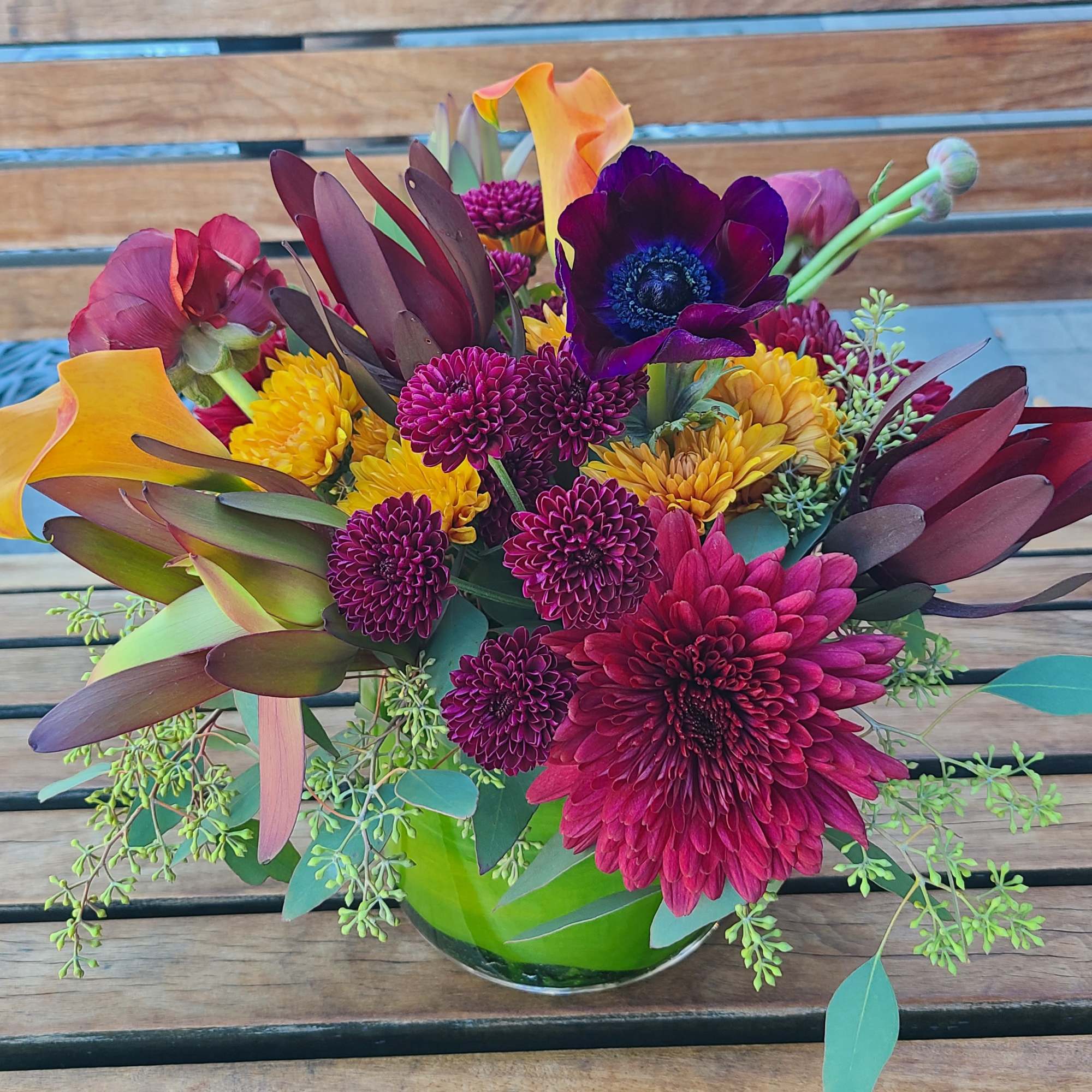 This richly colored medium size arrangement is the perfect way to dazzle