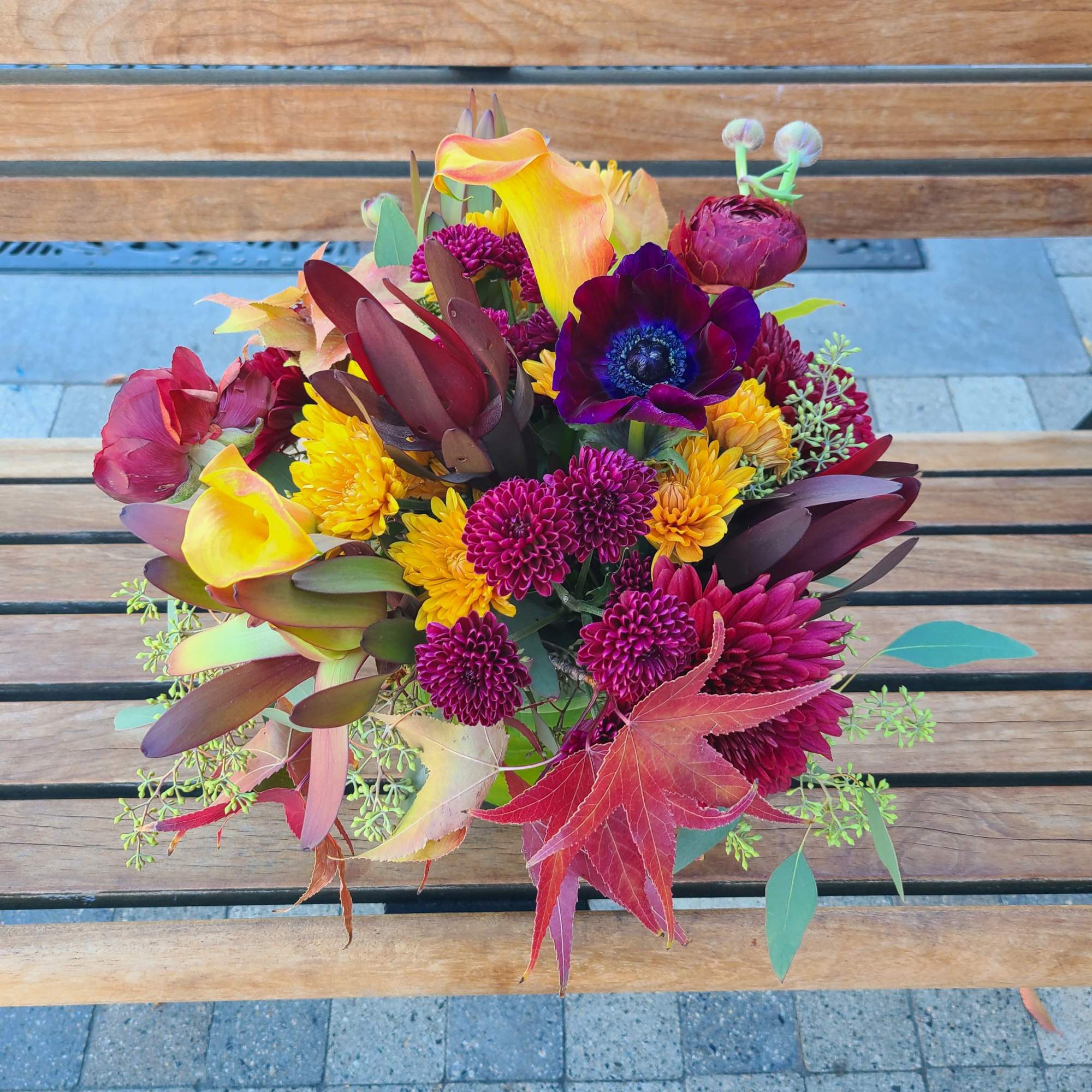 This richly colored medium size arrangement is the perfect way to dazzle