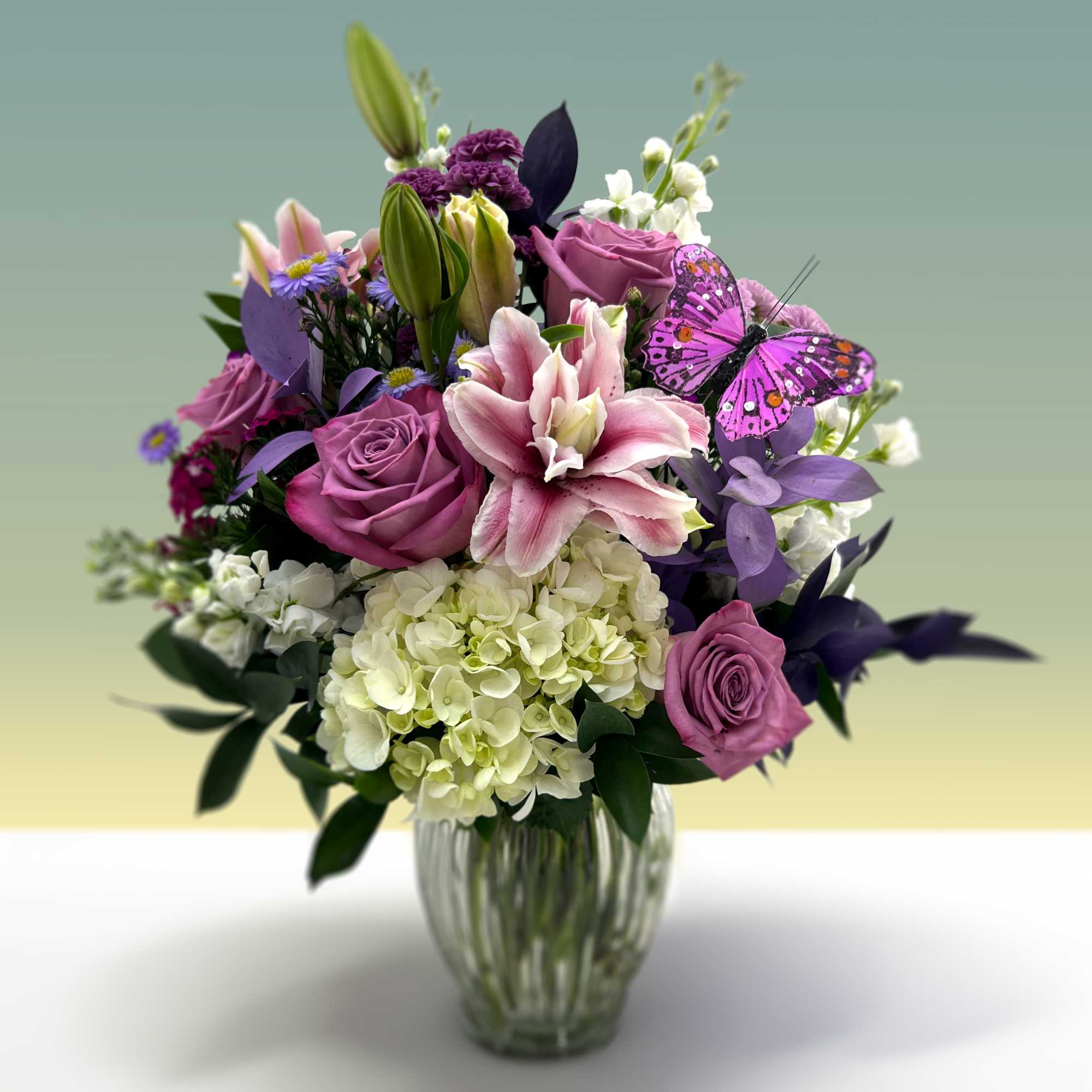 Give a big hug when gifting this bouquet of lavender roses, hydrangeas