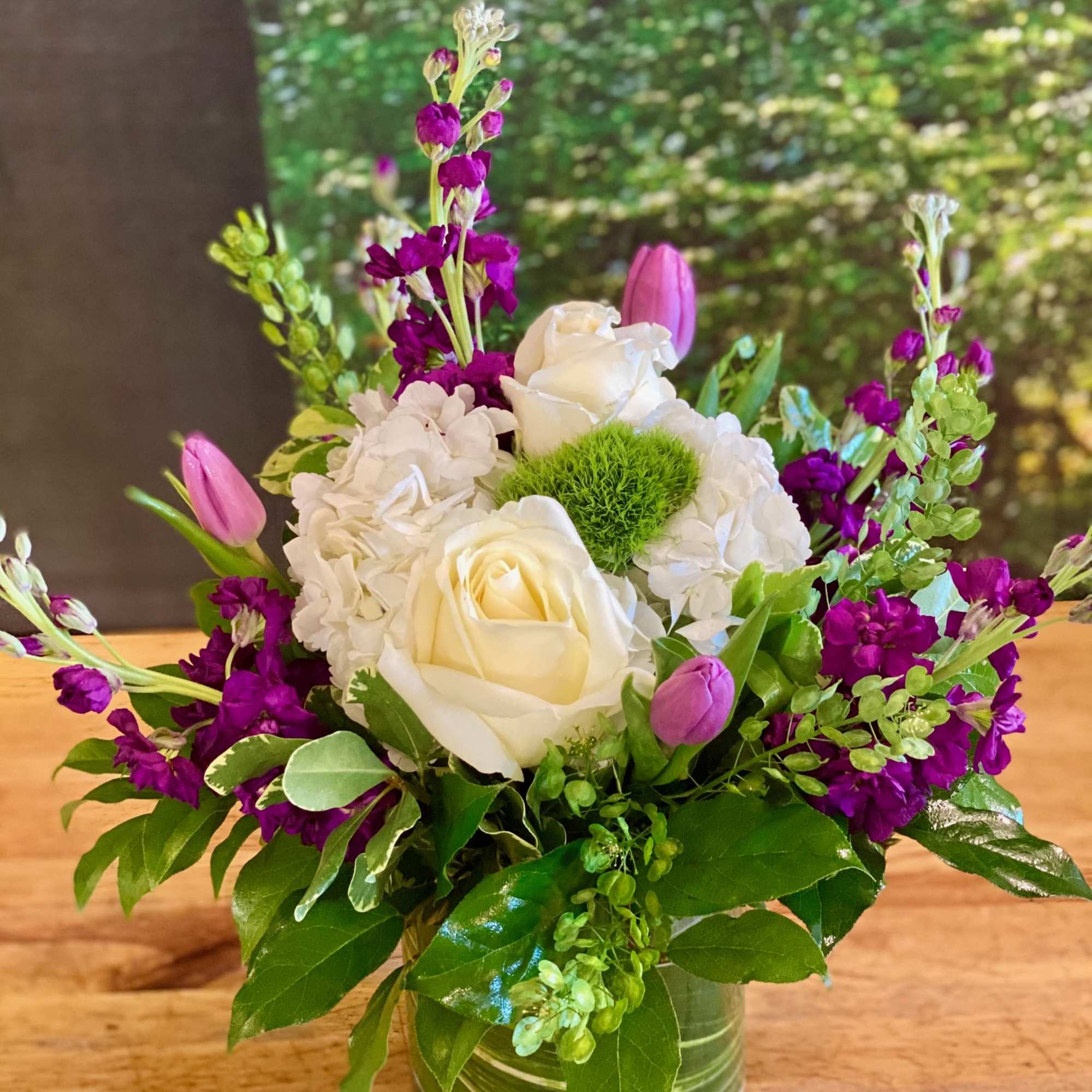 The "Garden Symphony" is a sweet and stylish arrangement is in harmony The "Garden Symphony" is a sweet and stylish arrangement is in harmony