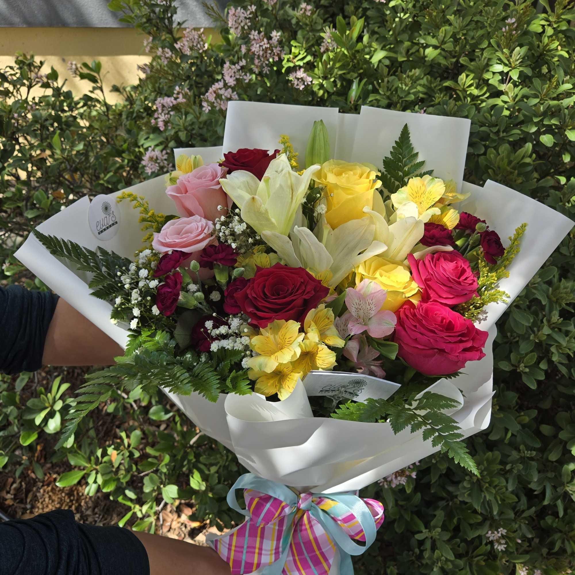 This Joyful Flower Bouquet wrapped in Korean paper contains:   colorful