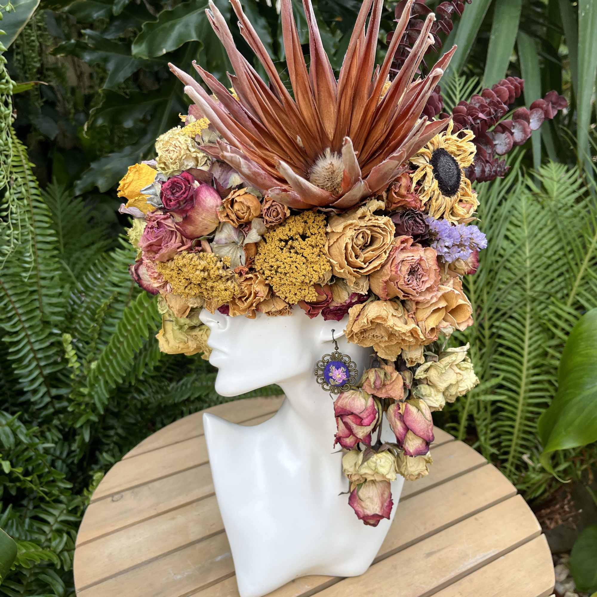This arrangement is about 20 inches tall, and is made from hand-cut This arrangement is about 20 inches tall, and is made from hand-cut