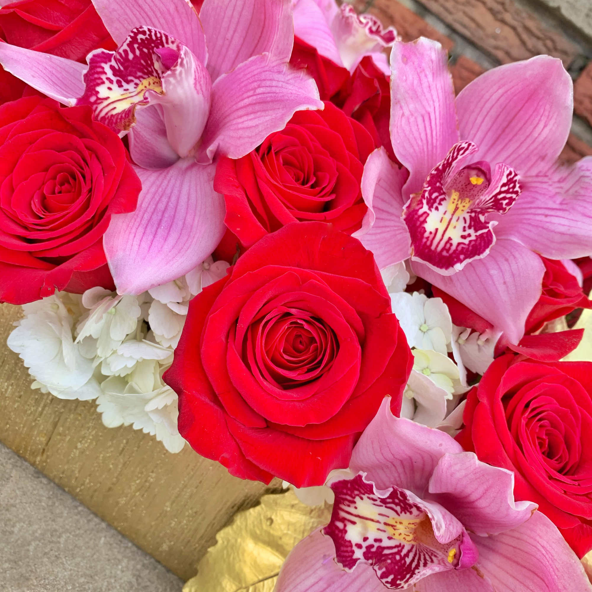 Looking to make a great impression? This luxe arrangement with Cymbidium Orchids