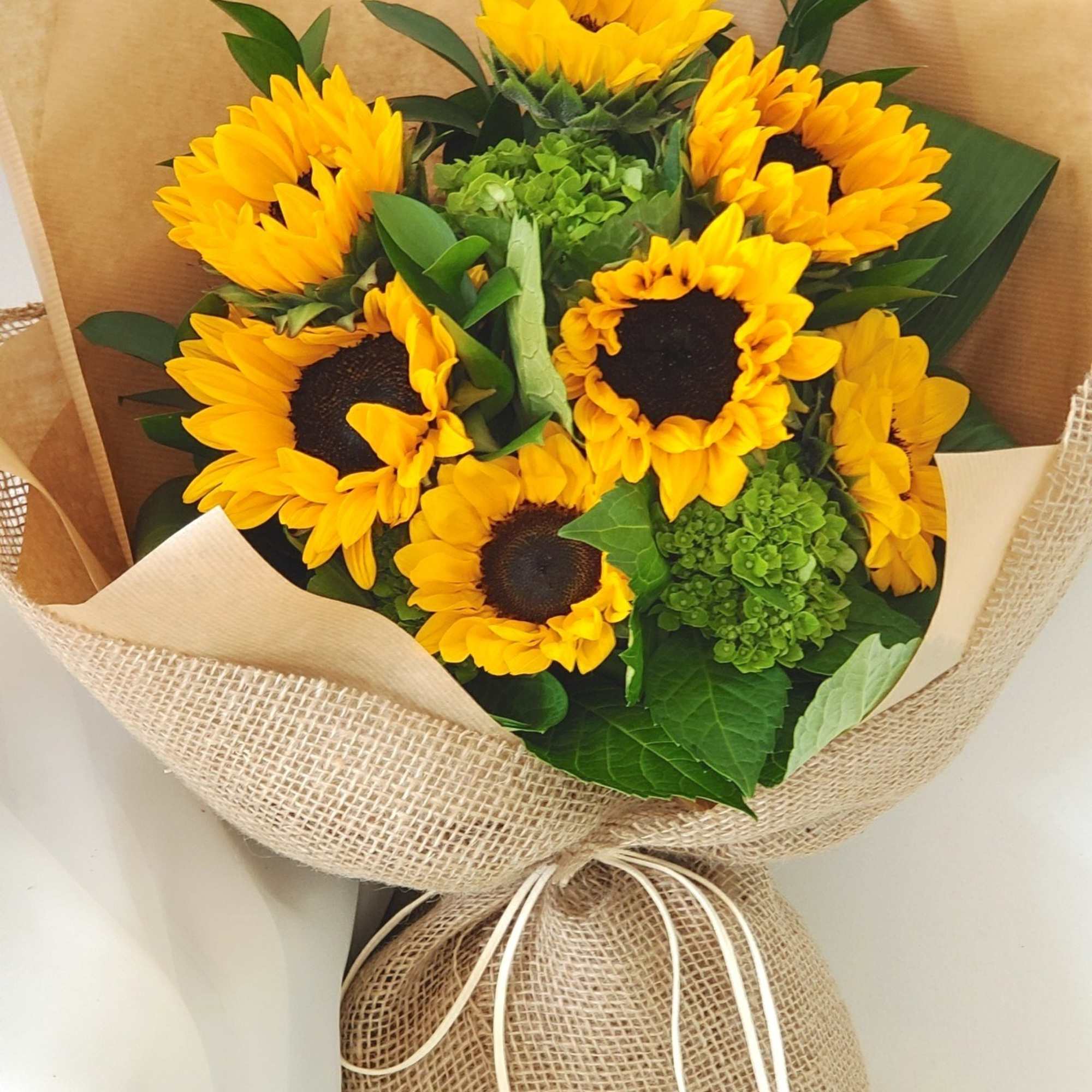 This simple yet lovely sunflower bouquet is perfect for any occasion.  This simple yet lovely sunflower bouquet is perfect for any occasion.