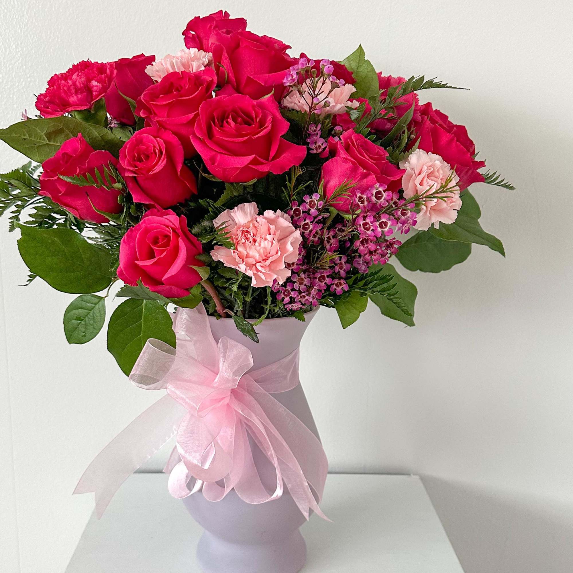 This is a large vase of flowers and is filled with 1 This is a large vase of flowers and is filled with 1