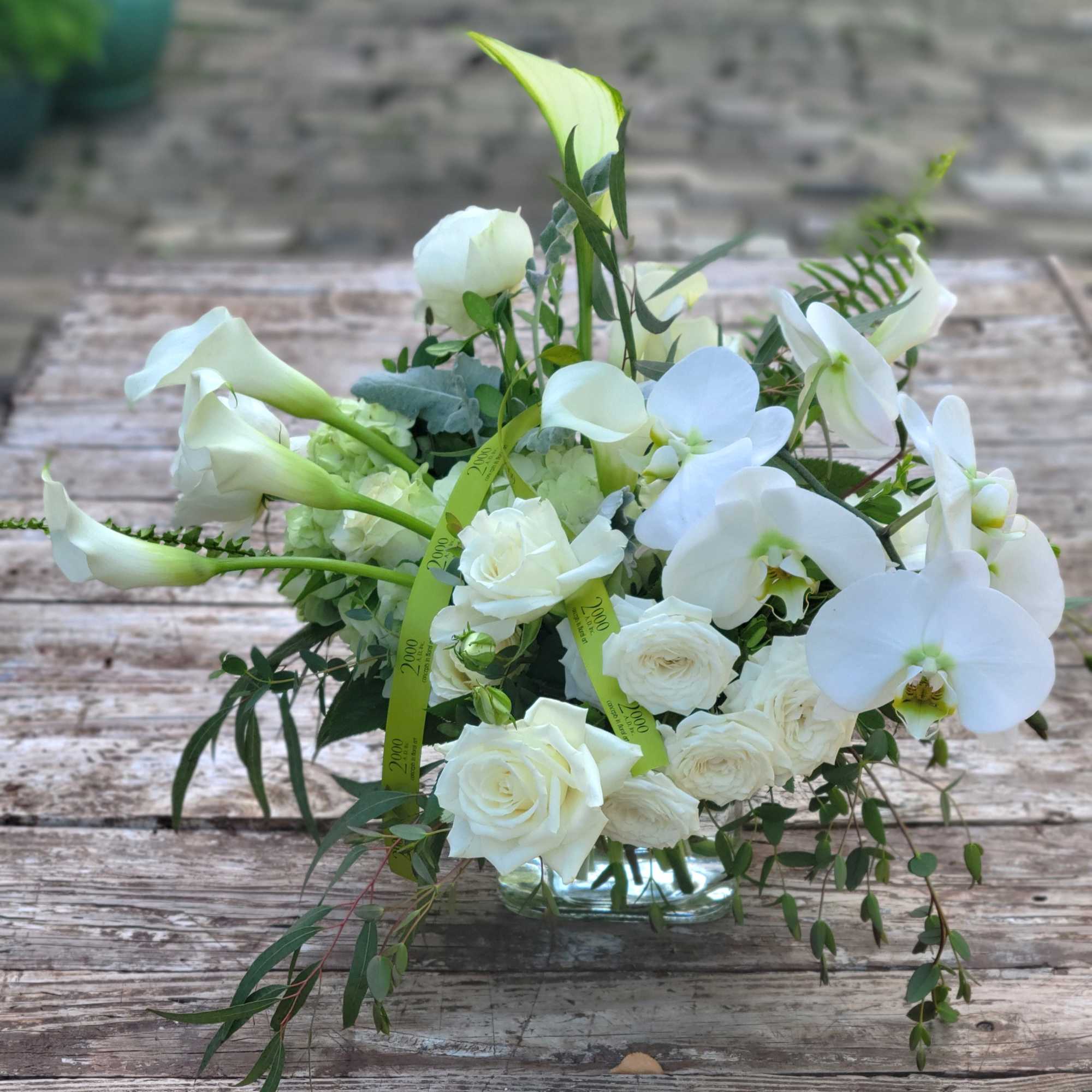 Joyful composition of white blooms in a variety of sizes and textures