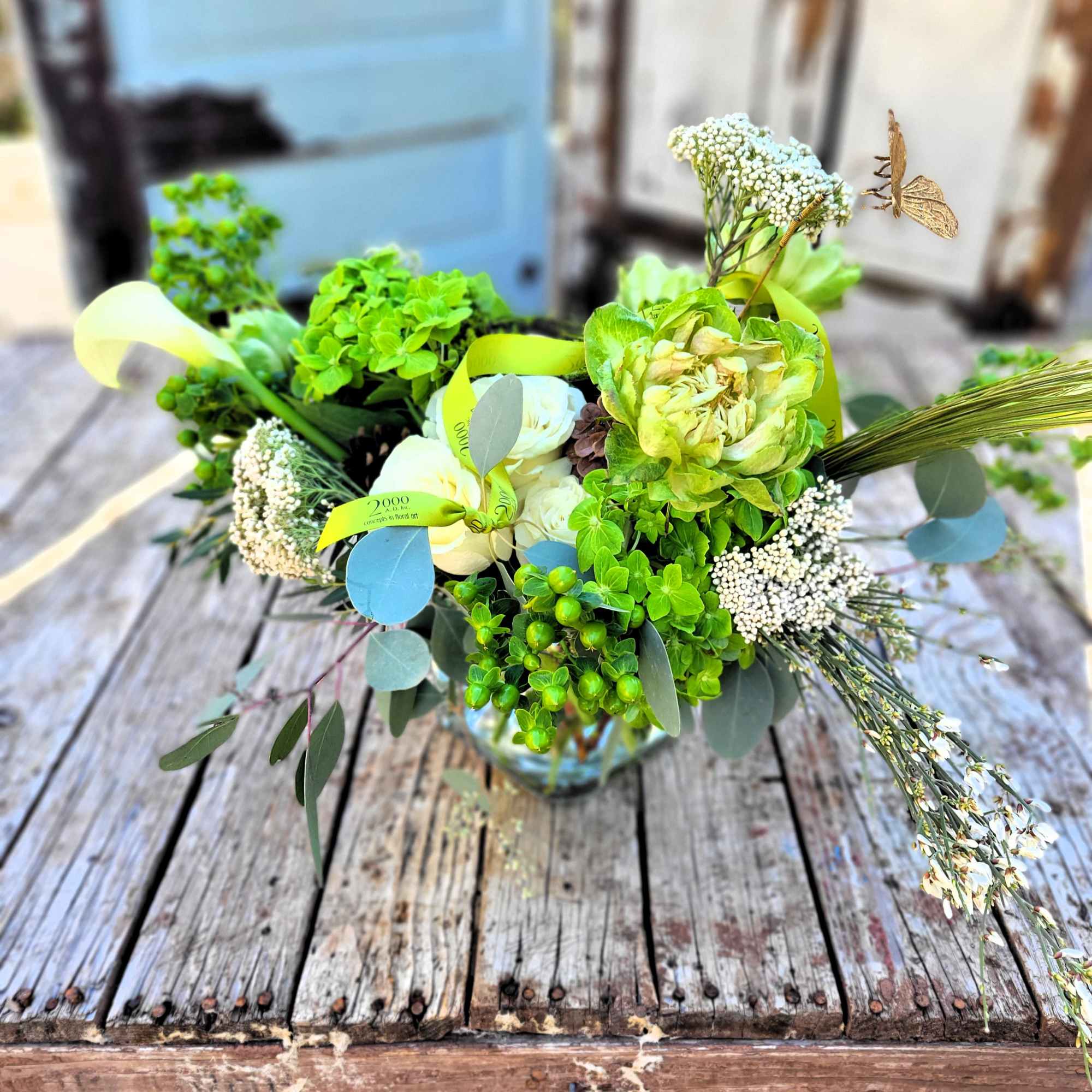 Tonal arrangement designed with an organic flair in shades of green and