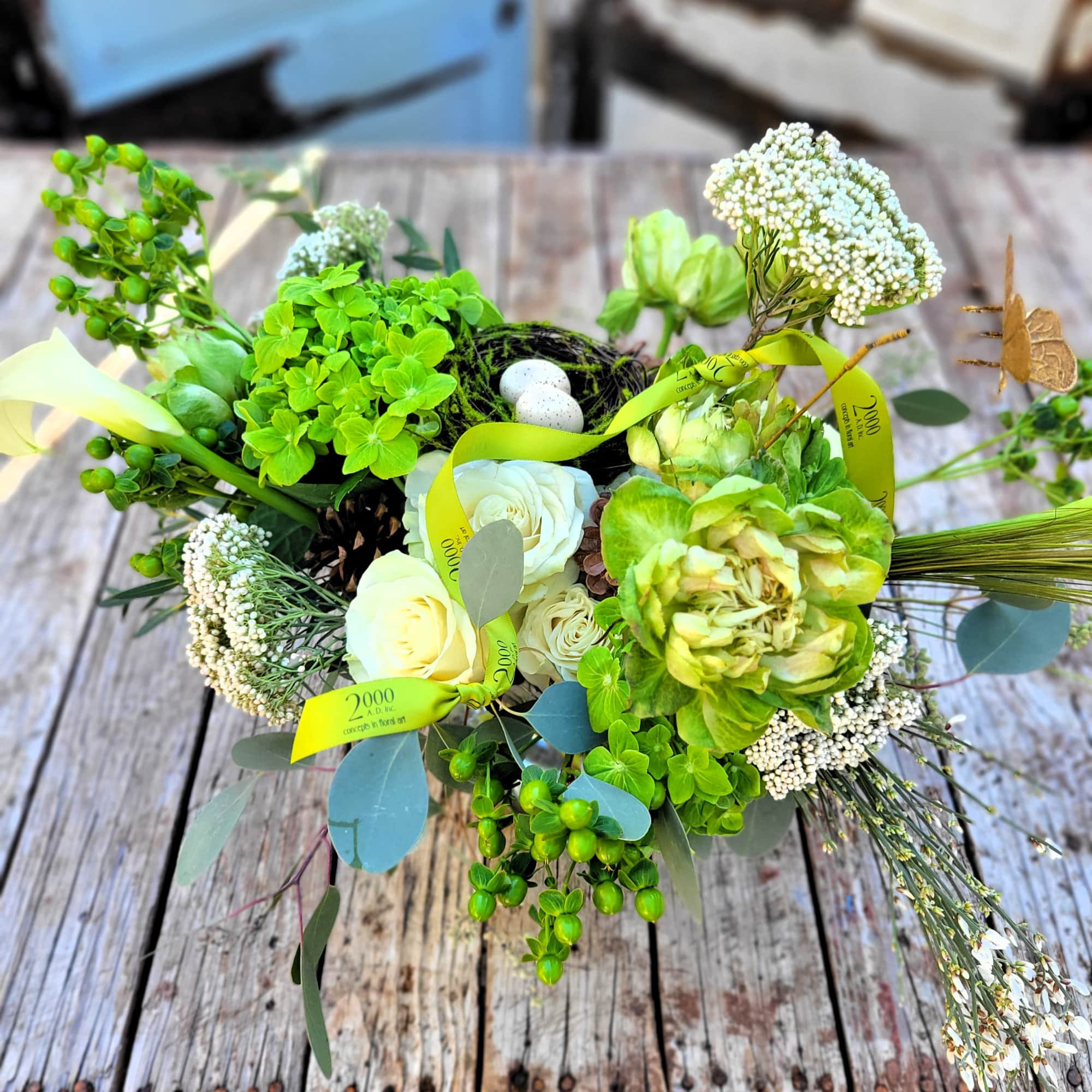 Tonal arrangement designed with an organic flair in shades of green and
