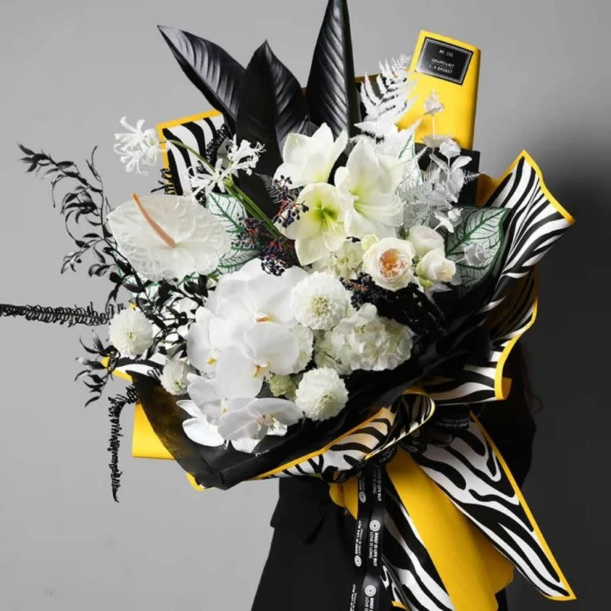 Celebrate with drama, style, and floral power!!

Honor their achievement with a show-stopping