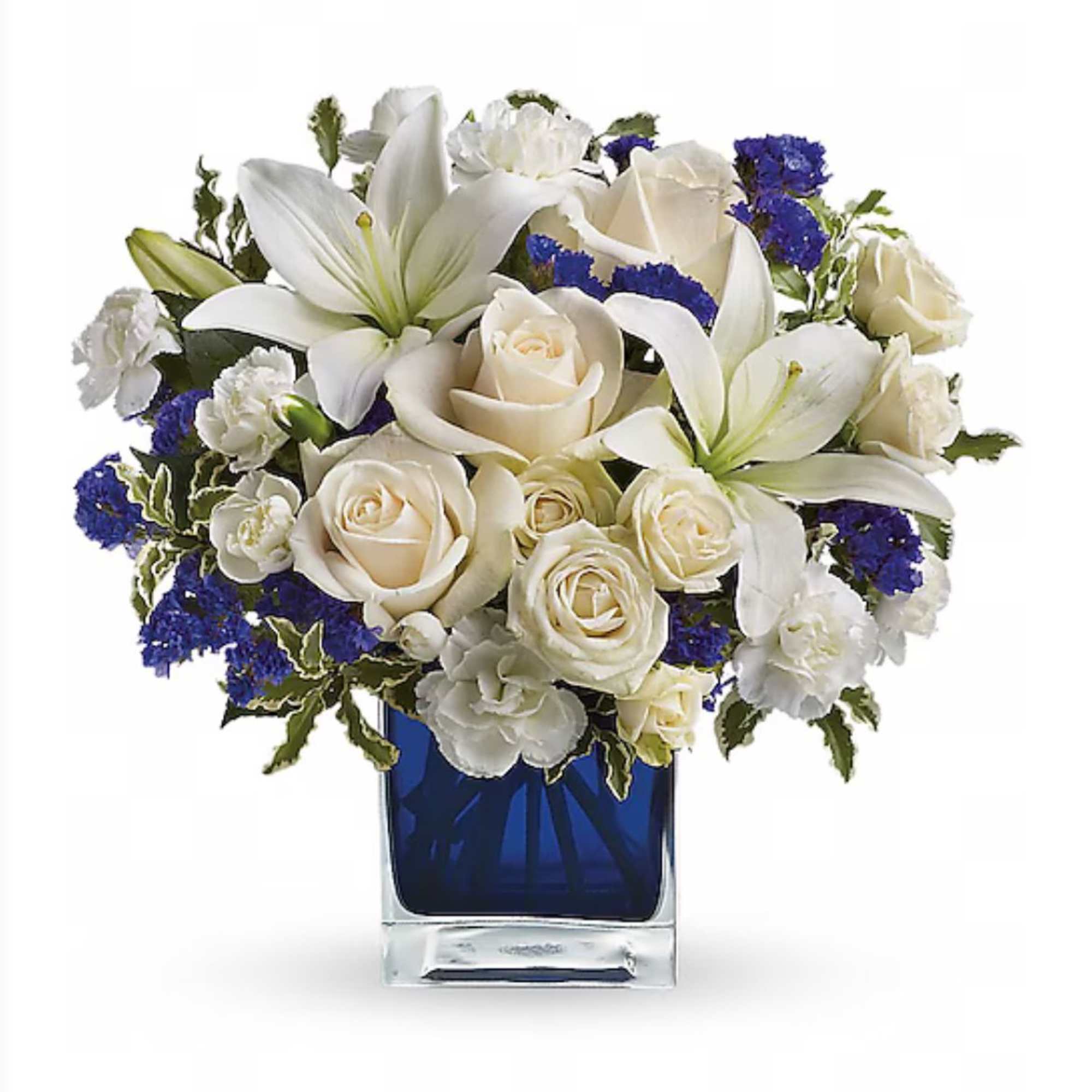 Stunning arrangement of white lilies, roses, mums, carnations, and touch of blue