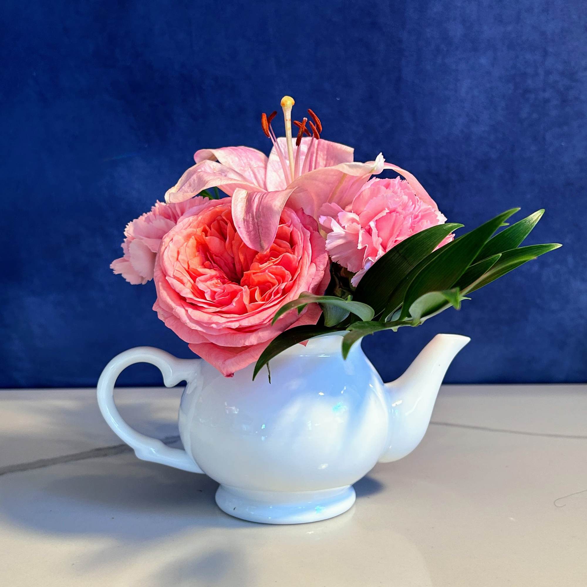 This arrangement is bound to bring joy! Garden roses and pink carnations This arrangement is bound to bring joy! Garden roses and pink carnations