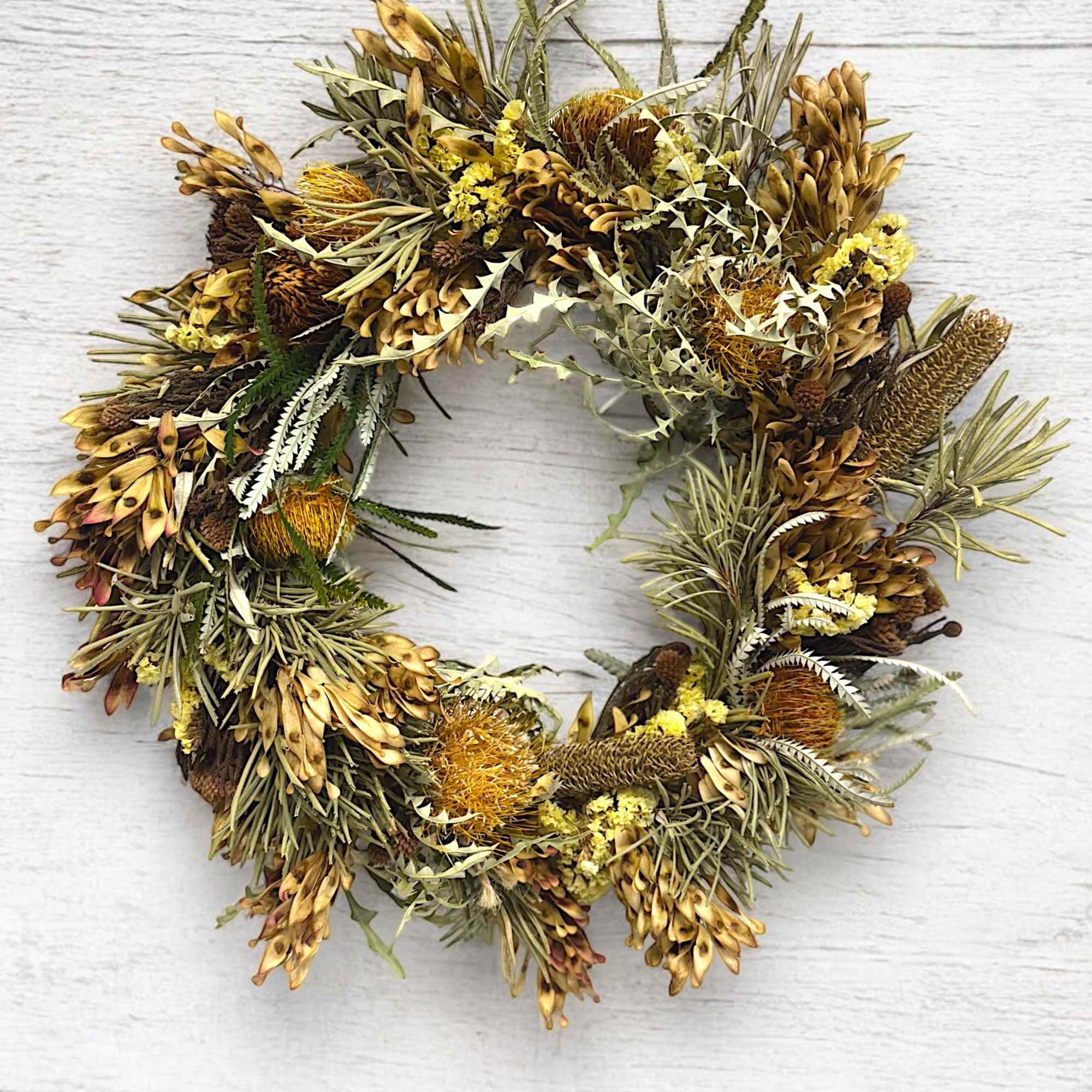 A gorgeous and natural dried wreath of high quality dried florals. Showcasing