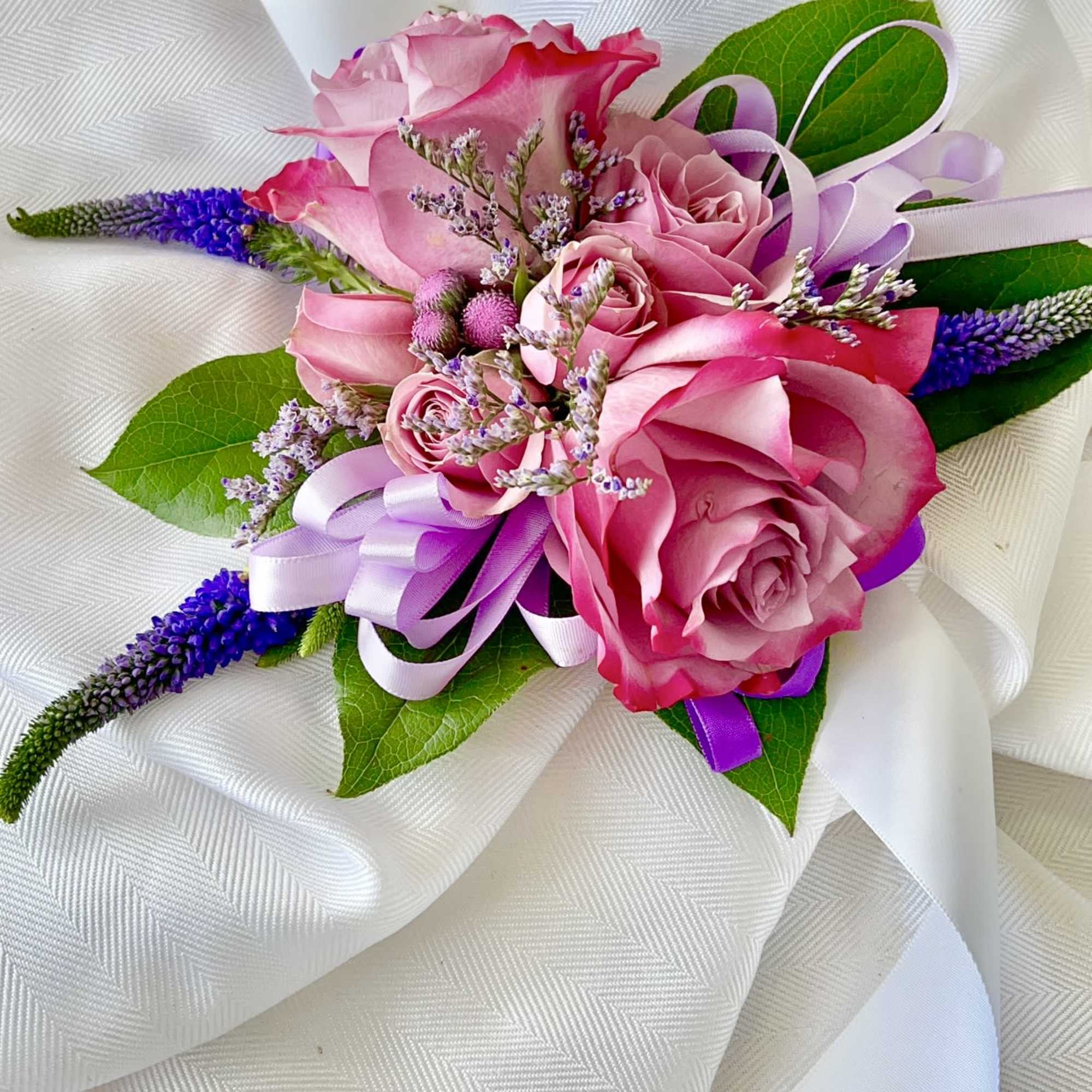Made from fresh flowers, a corsage looks like a petite flower arrangement Made from fresh flowers, a corsage looks like a petite flower arrangement