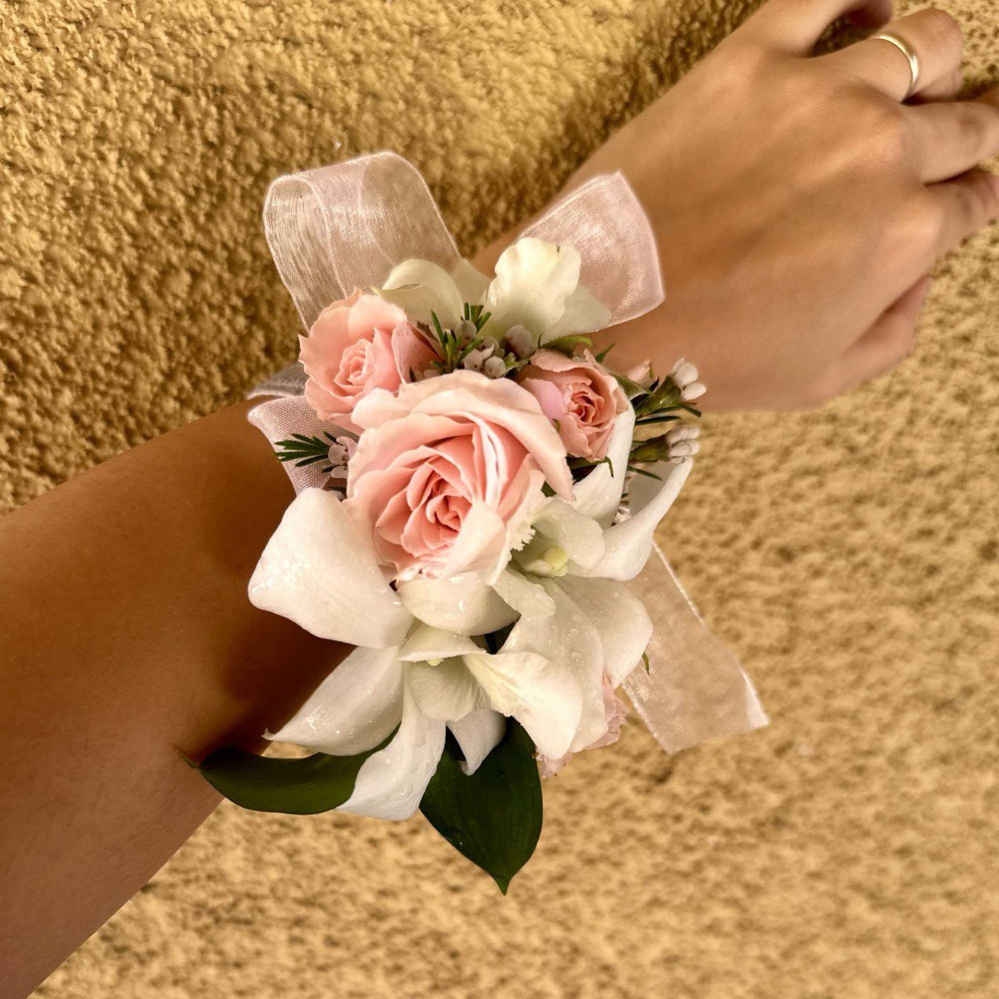 Set of Corsage and Boutonniere include white dendrobium orchids and pink spray