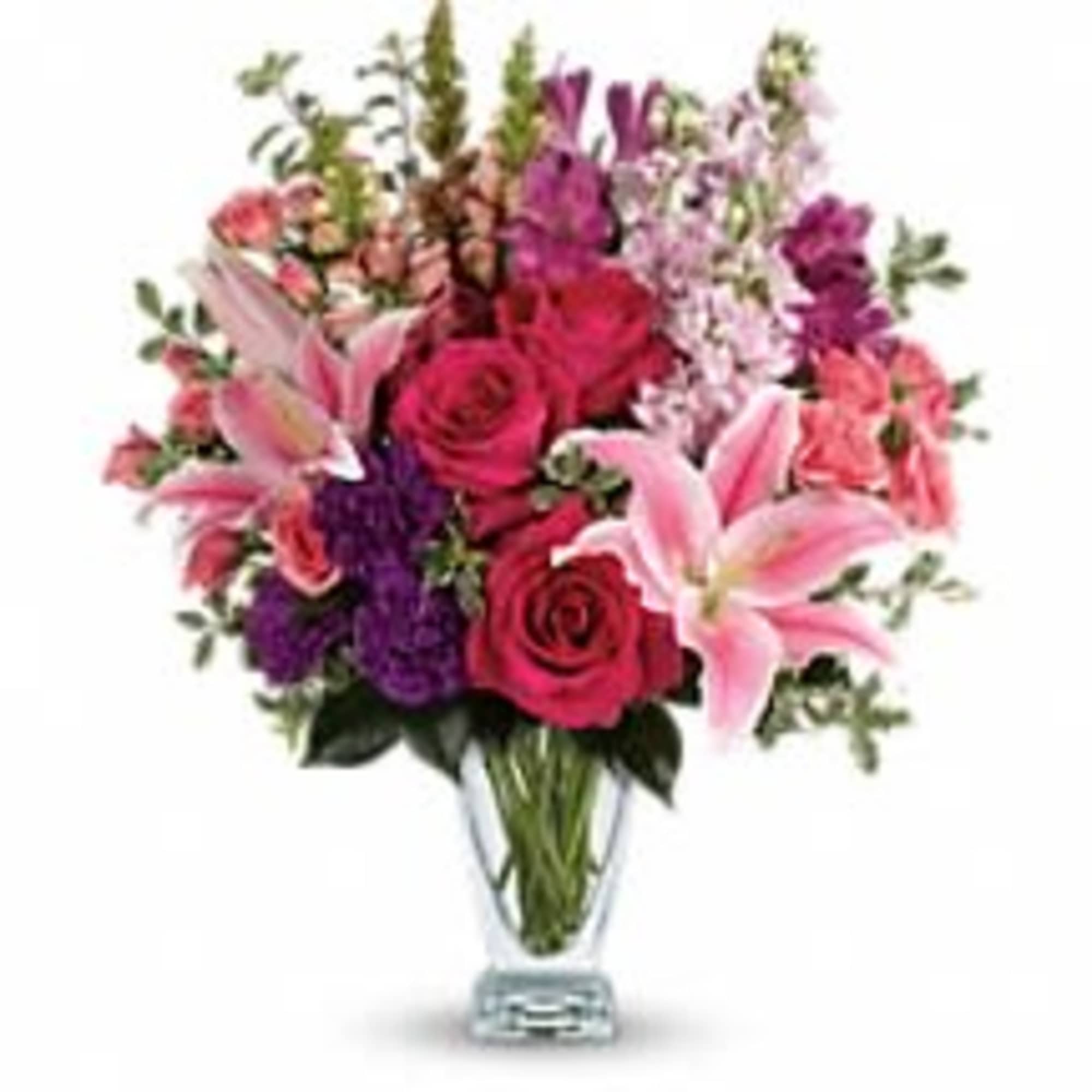 Hand-delivered in a shapely glass vase, this sumptuous arrangement of roses and