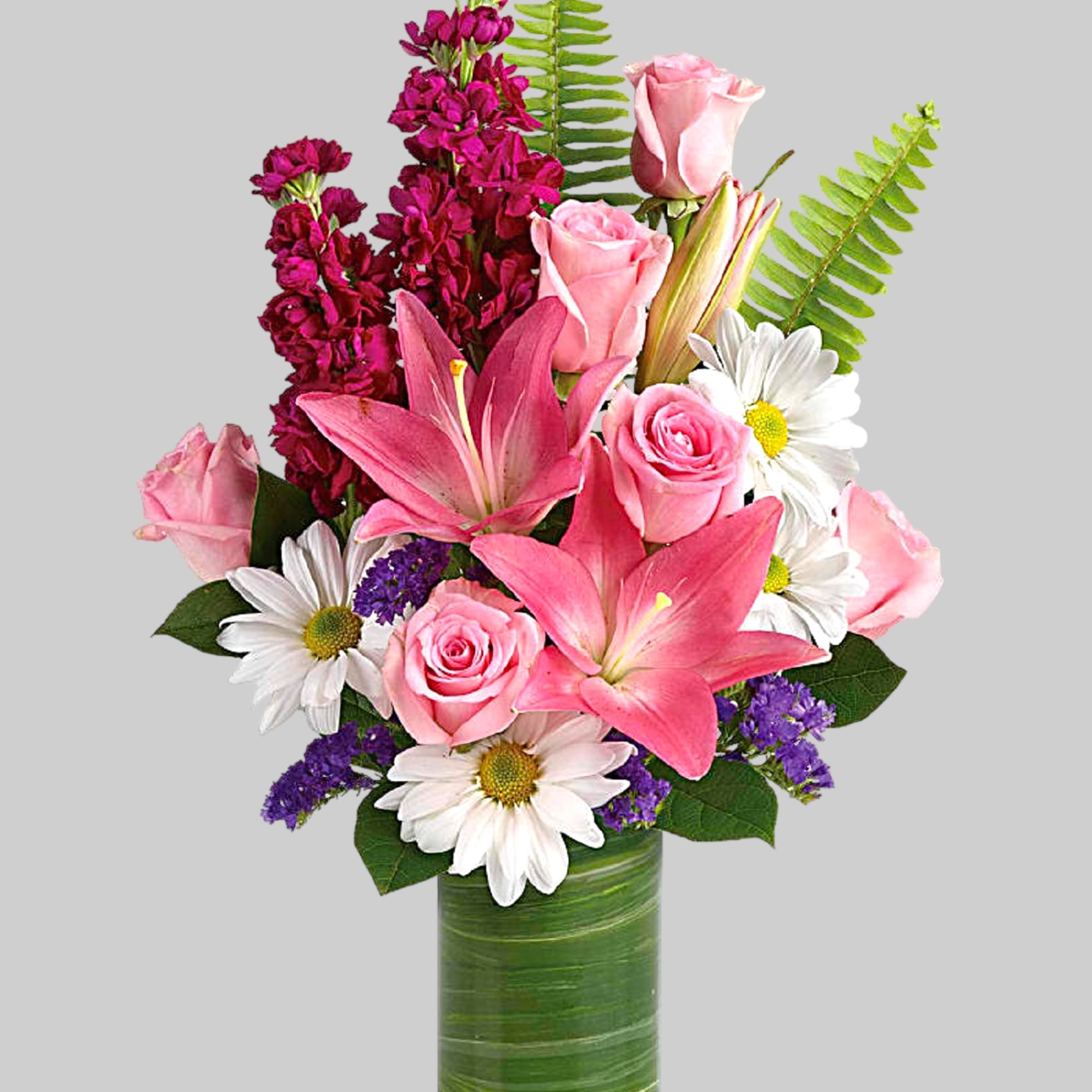 Full of whimsy, this playful bouquet of pink roses, white daisies, pink