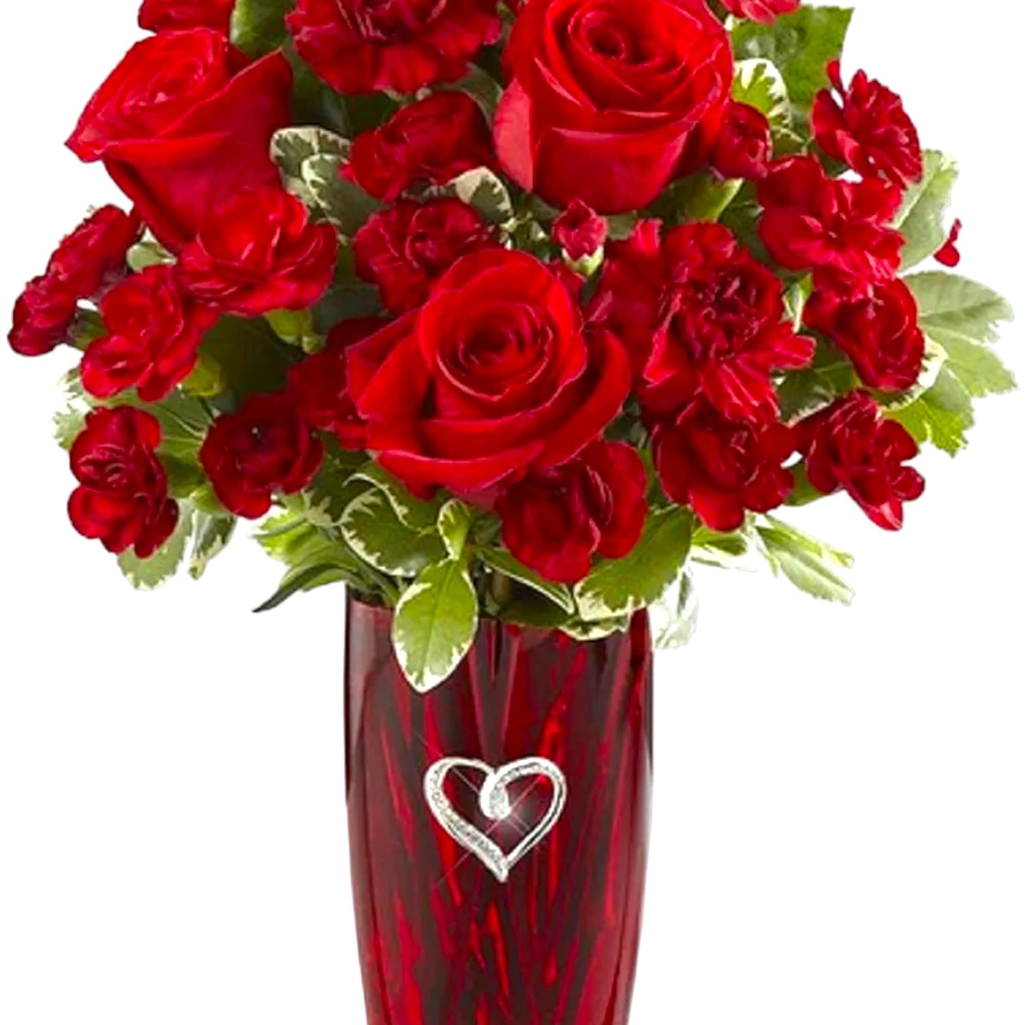 This vase includes a brilliant burst of red carnations and beautiful greens.