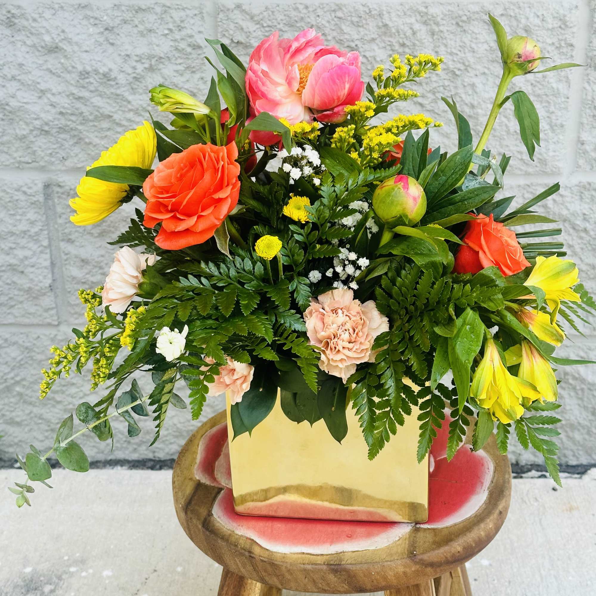 A designer will create a beautiful floral arrangement with the freshest blooms