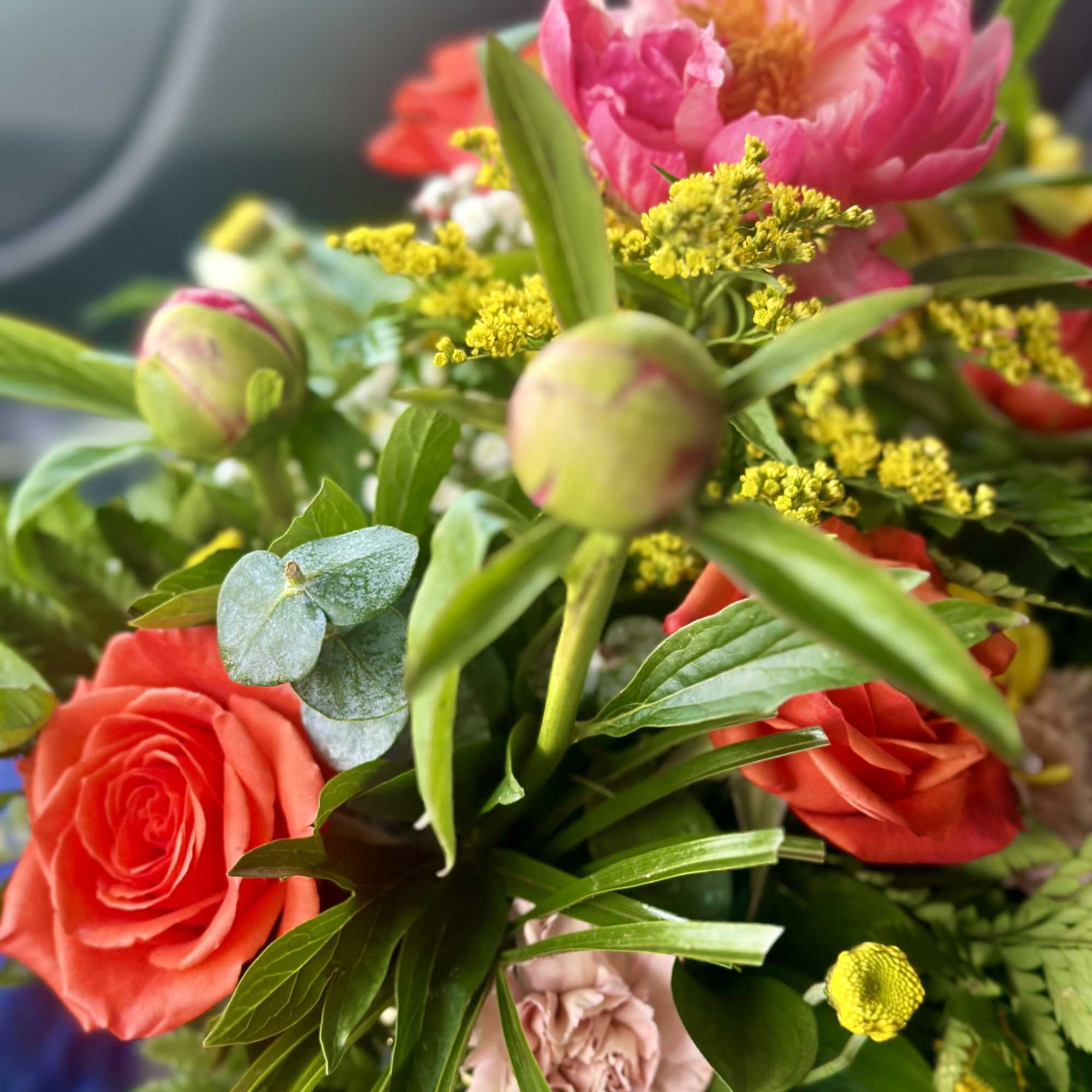 A designer will create a beautiful floral arrangement with the freshest blooms