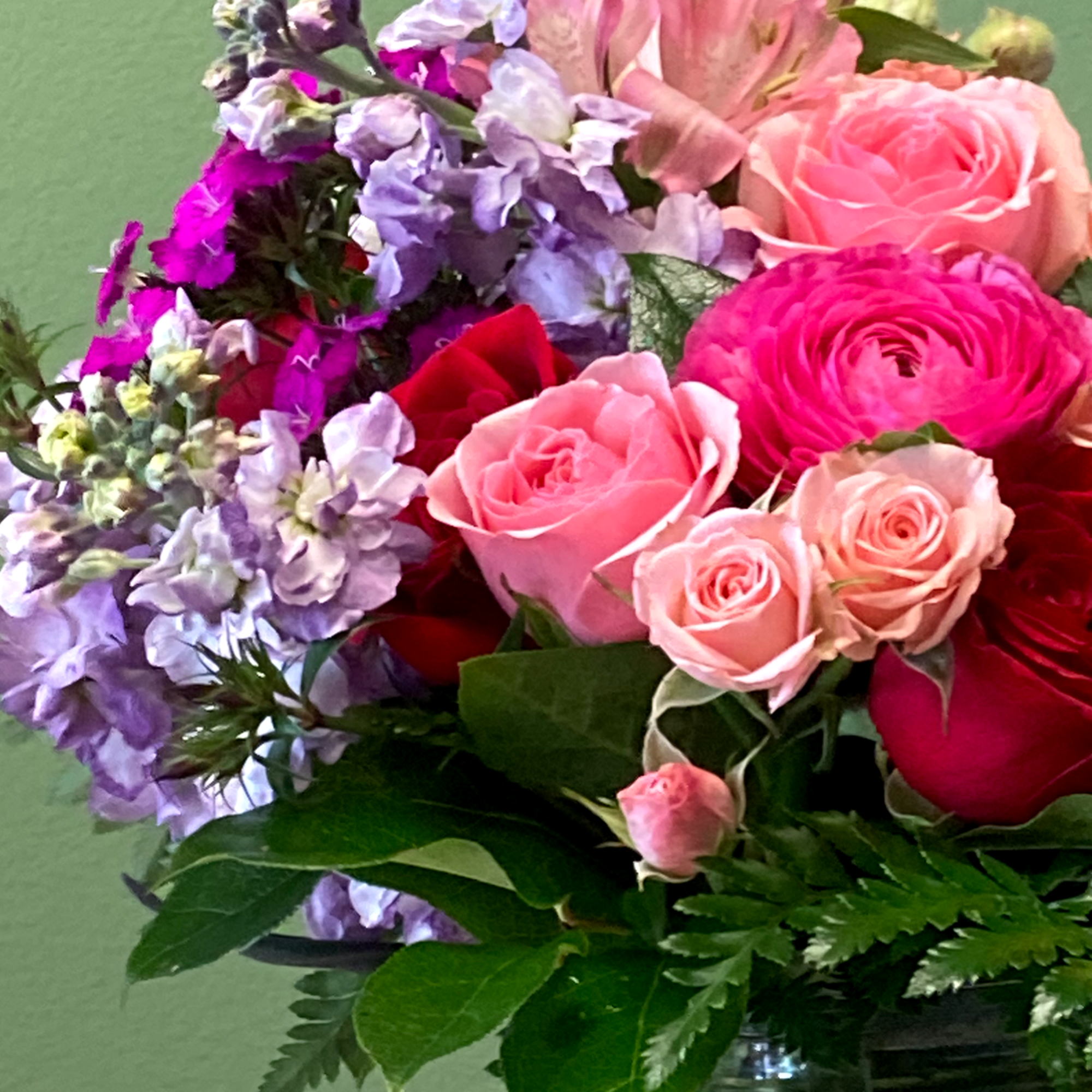 Our signature mixed arrangement combines a delightful blend of red, blush and