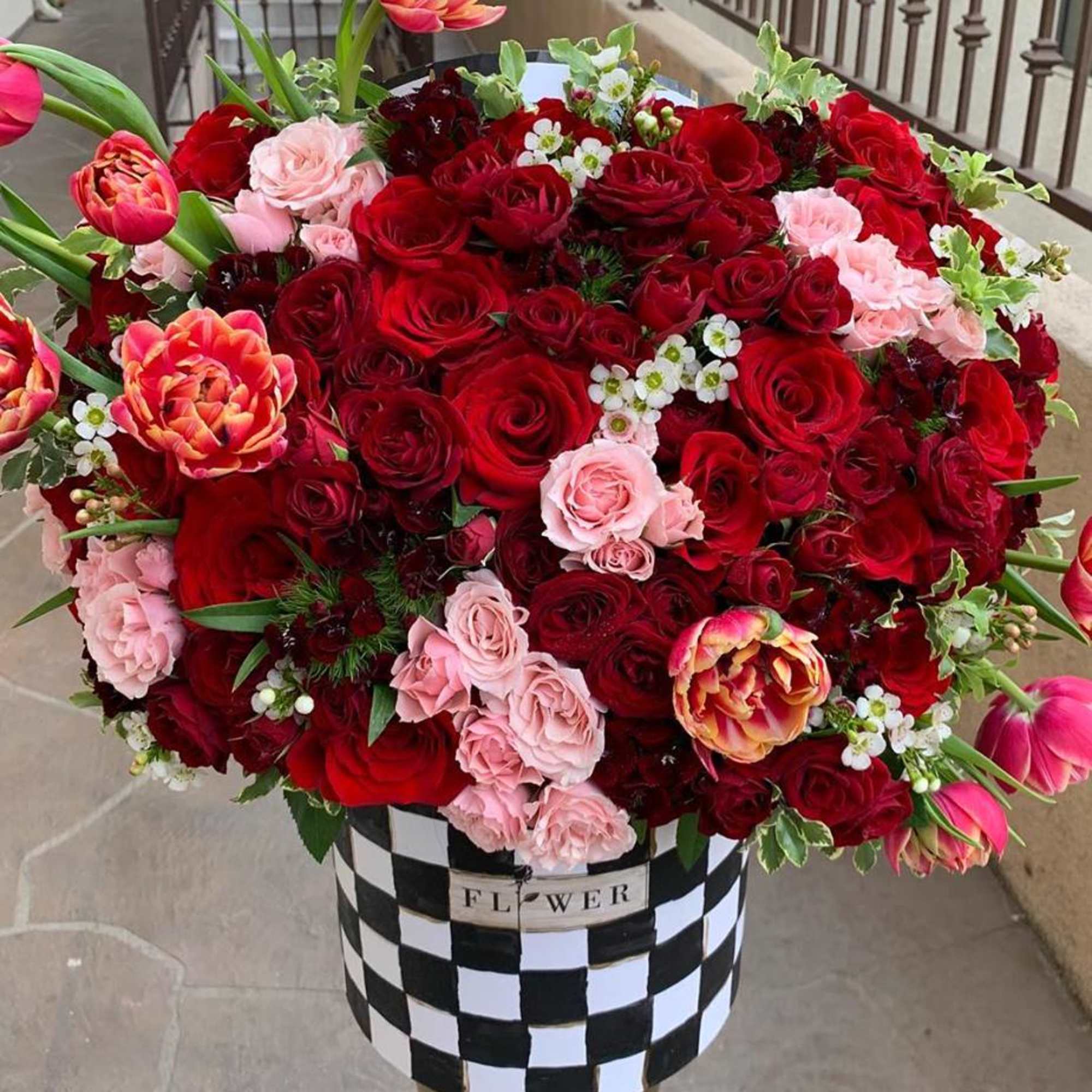 Designer inspired box filled with a mixture of gorgeous red roses, tulips Designer inspired box filled with a mixture of gorgeous red roses, tulips