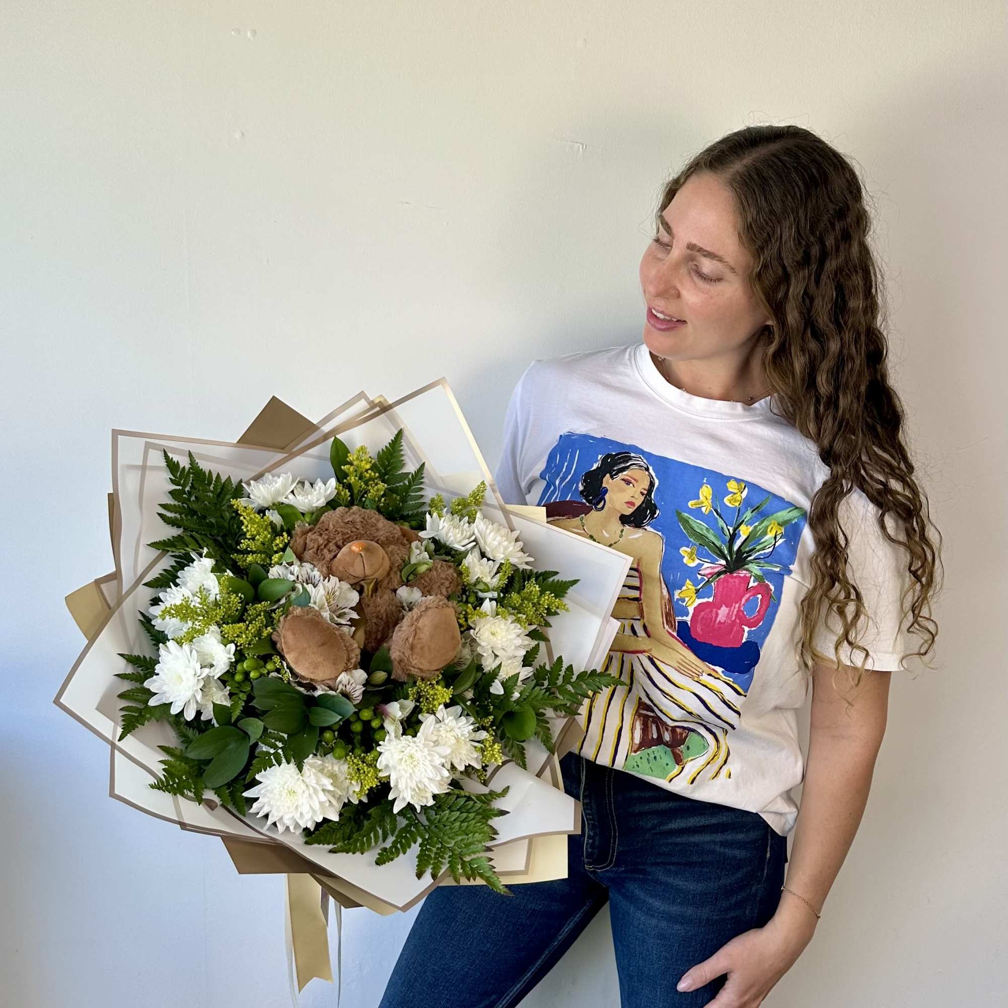 A heartwarming blend of flowers and cuddles!
Our Teddy Bloom Bouquet is a