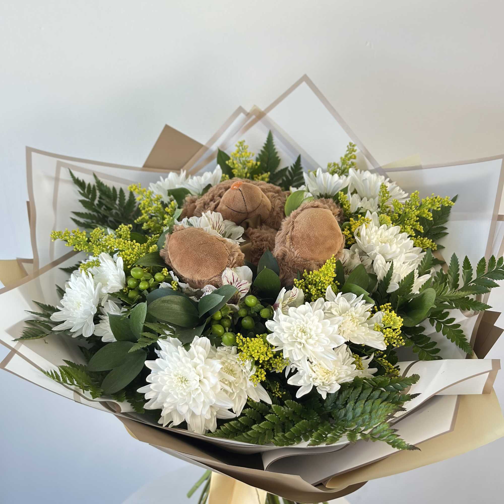 A heartwarming blend of flowers and cuddles!
Our Teddy Bloom Bouquet is a
