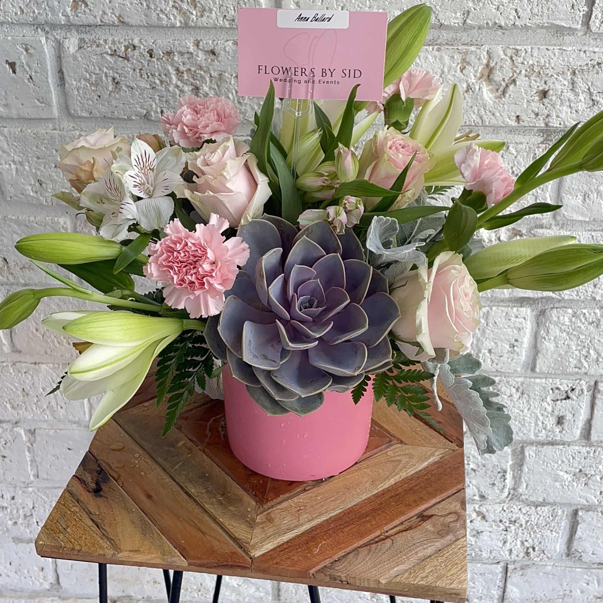 Lovely combination of pinks and whites blooms, seasonal greenery and high quality