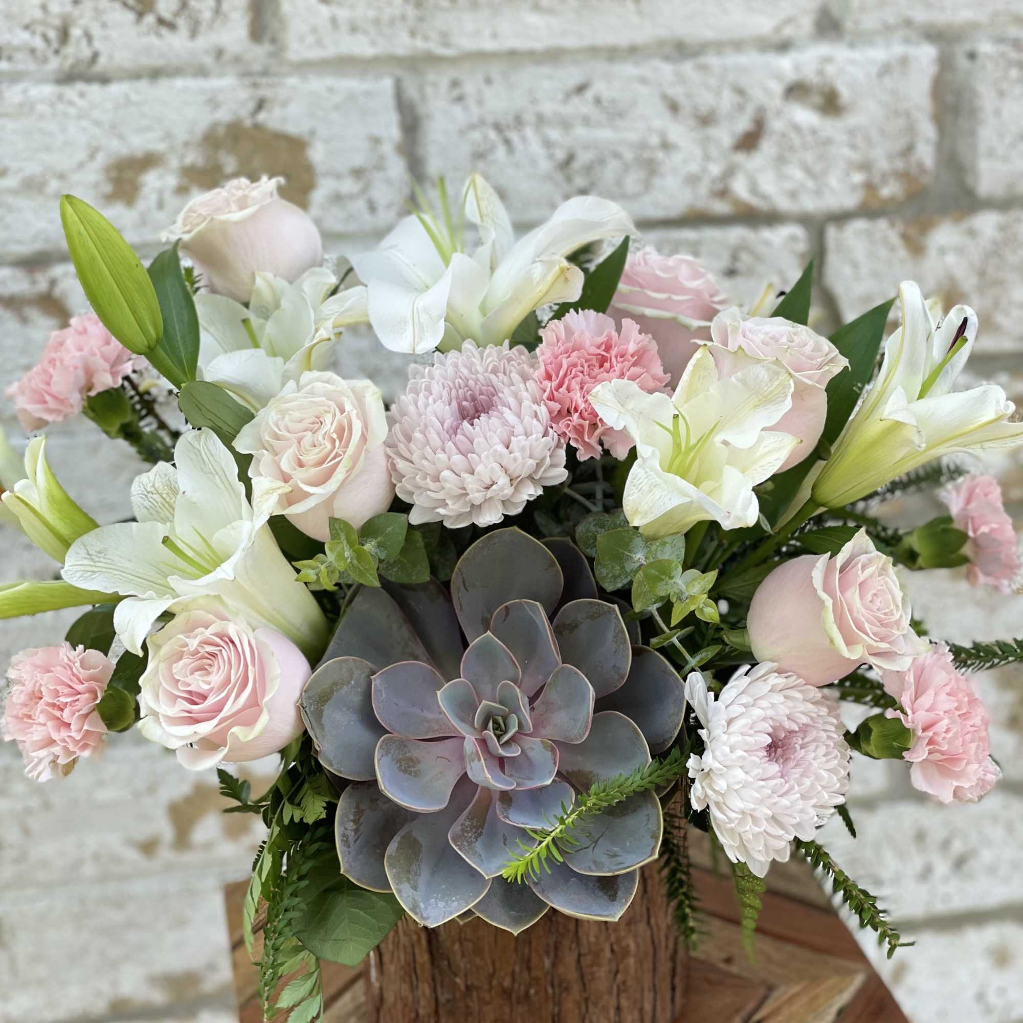 Lovely combination of pinks and whites blooms, seasonal greenery and high quality
