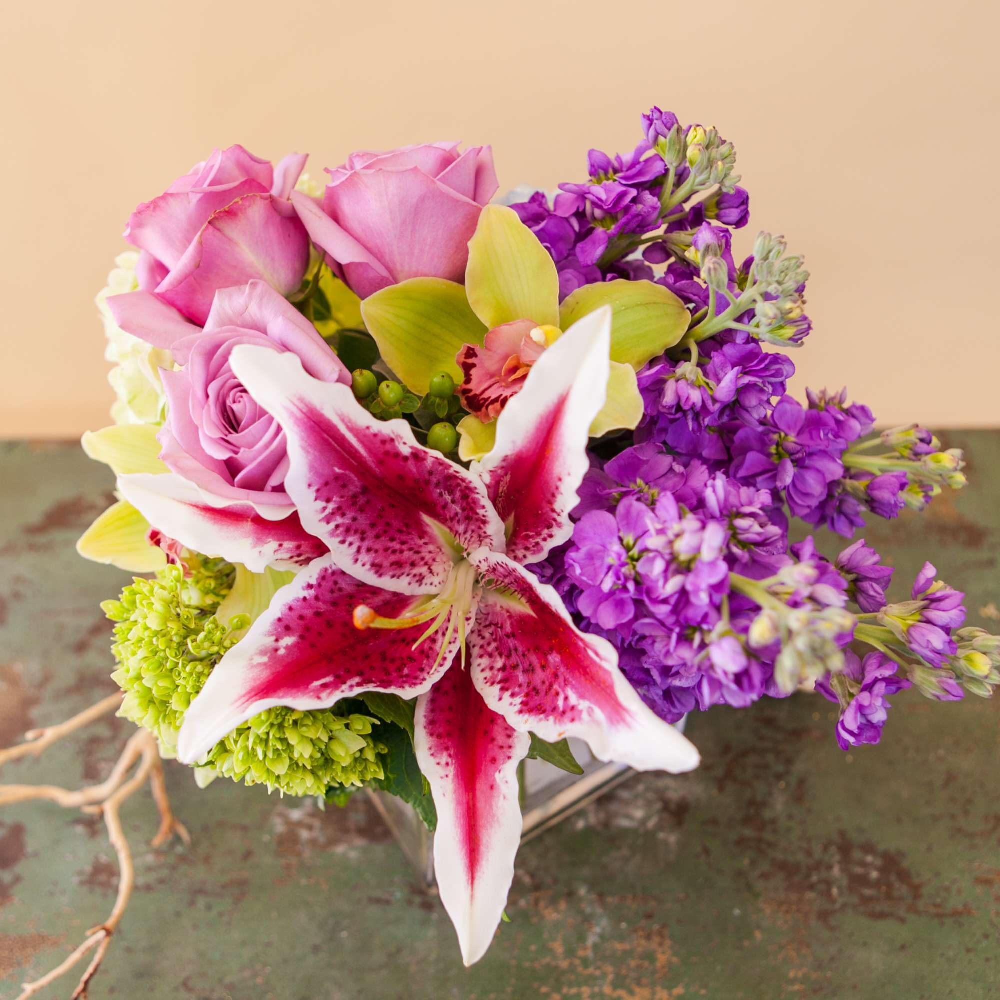 A stunning, pastel compact arrangement of hydrangea, roses, lilies, orchids and other A stunning, pastel compact arrangement of hydrangea, roses, lilies, orchids and other