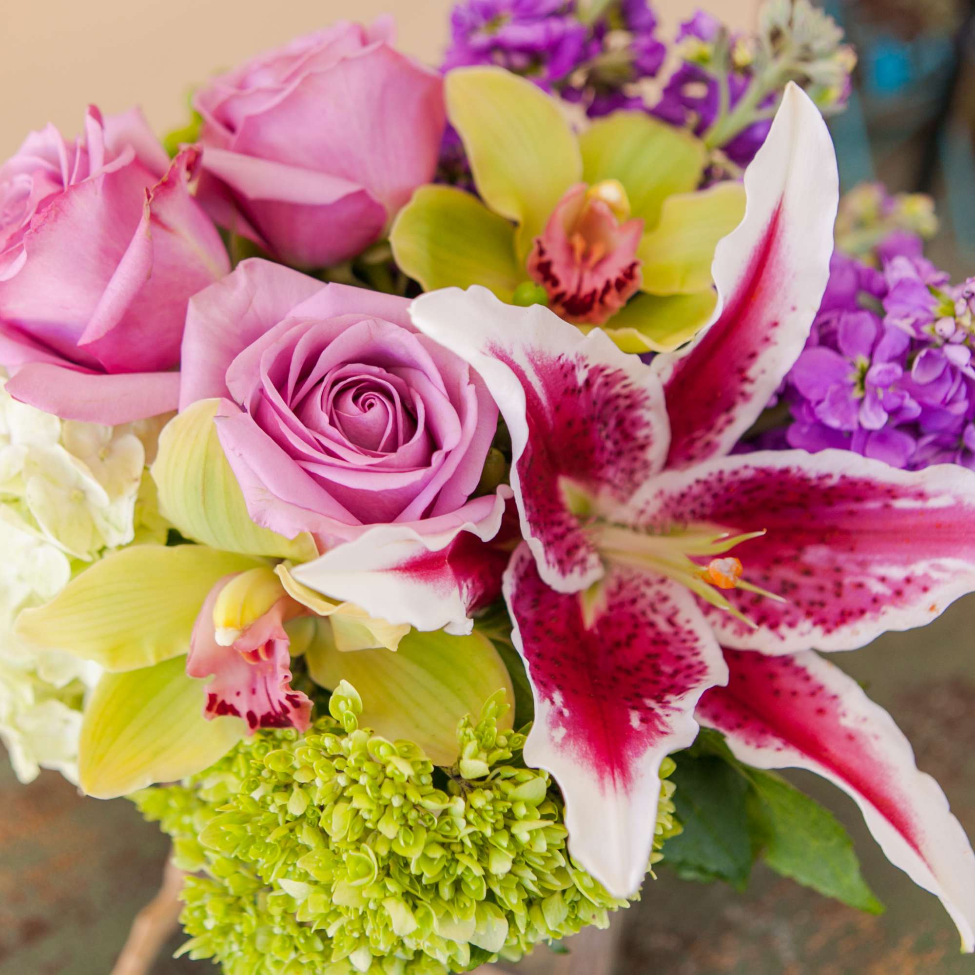 A stunning, pastel compact arrangement of hydrangea, roses, lilies, orchids and other A stunning, pastel compact arrangement of hydrangea, roses, lilies, orchids and other