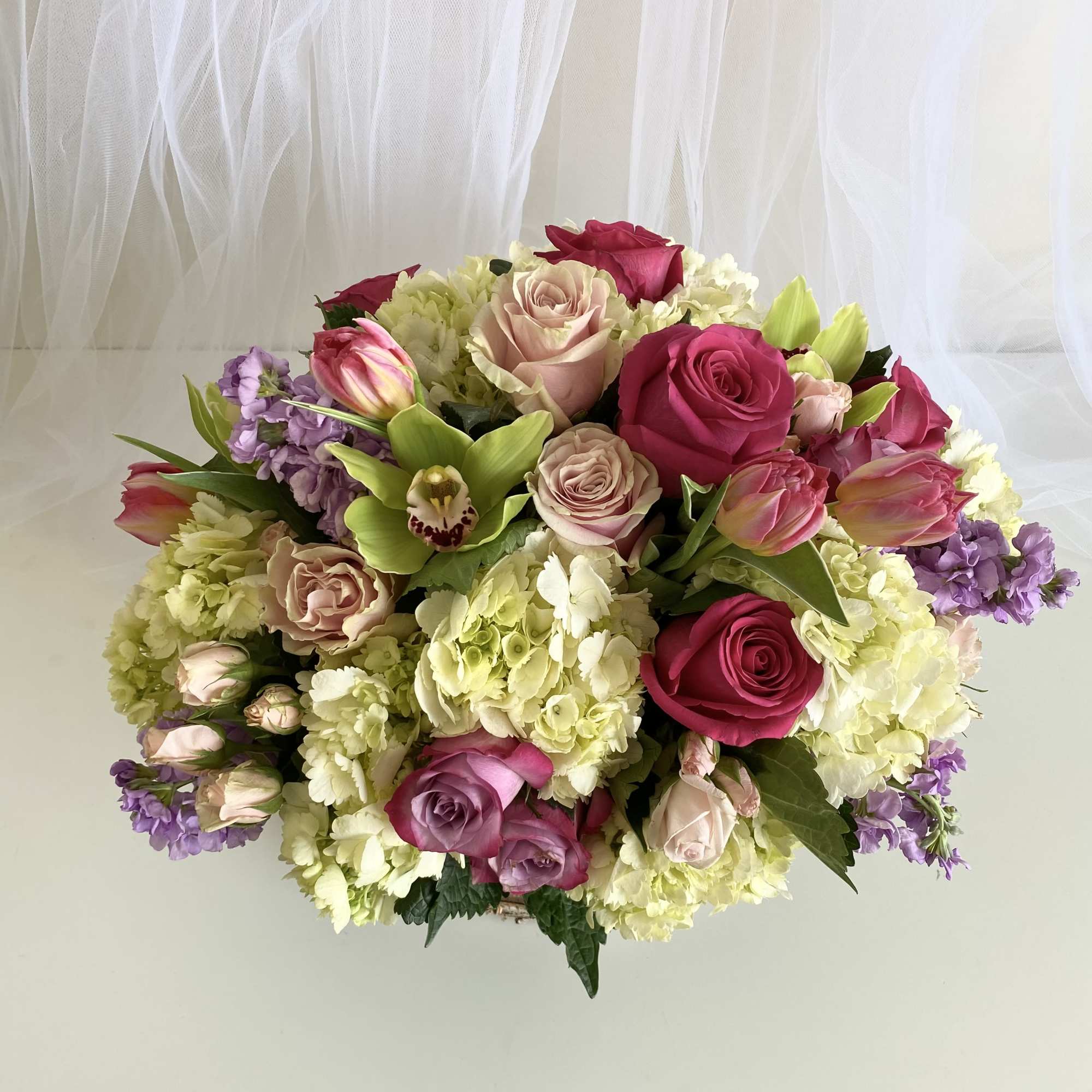 Theme Colors: Shades of pinks, purples and whites
Featured Blooms: Roses, Tulips, Spray Theme Colors: Shades of pinks, purples and whites
Featured Blooms: Roses, Tulips, Spray