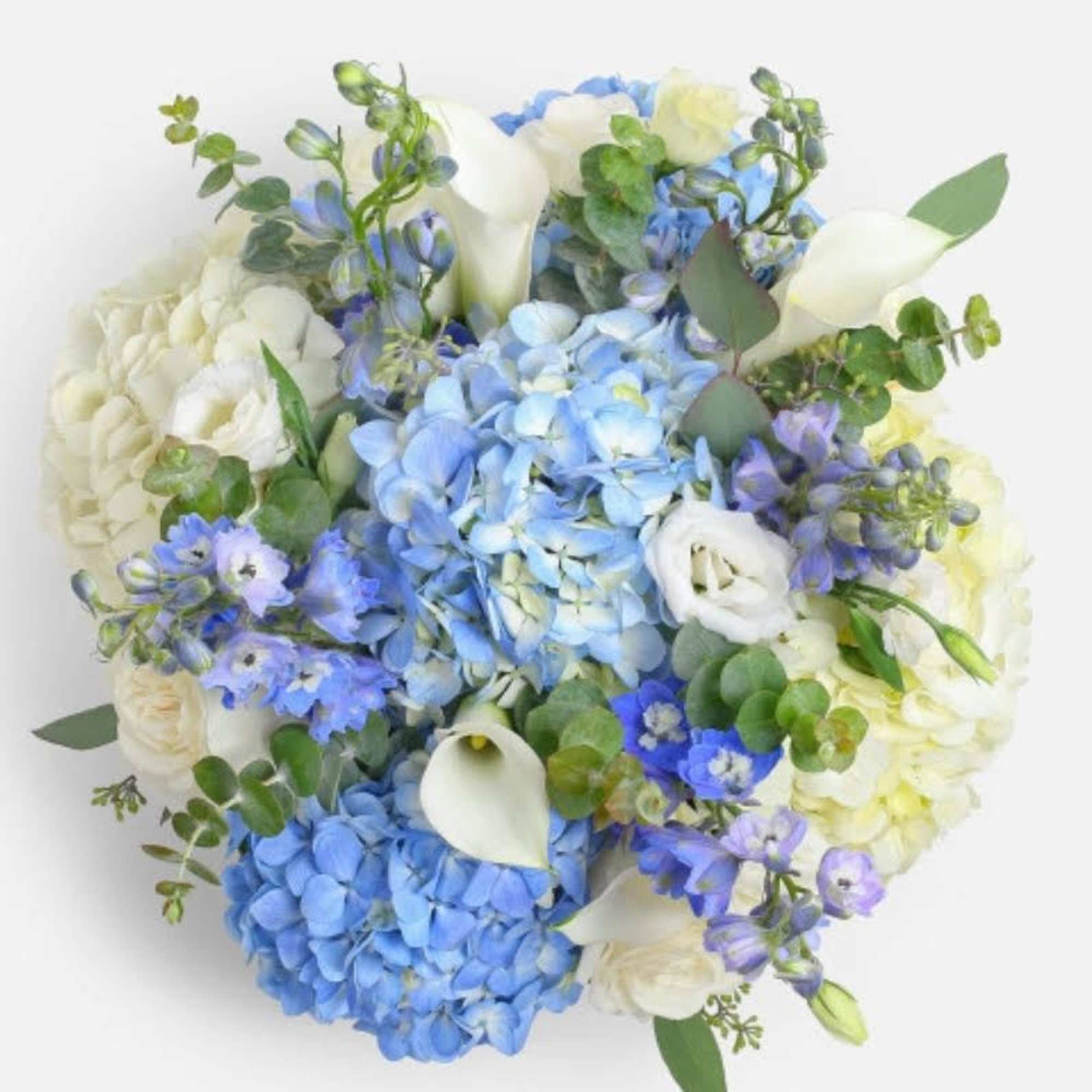 Blue delphinium, white roses, and calla lilies with lovely blue and white