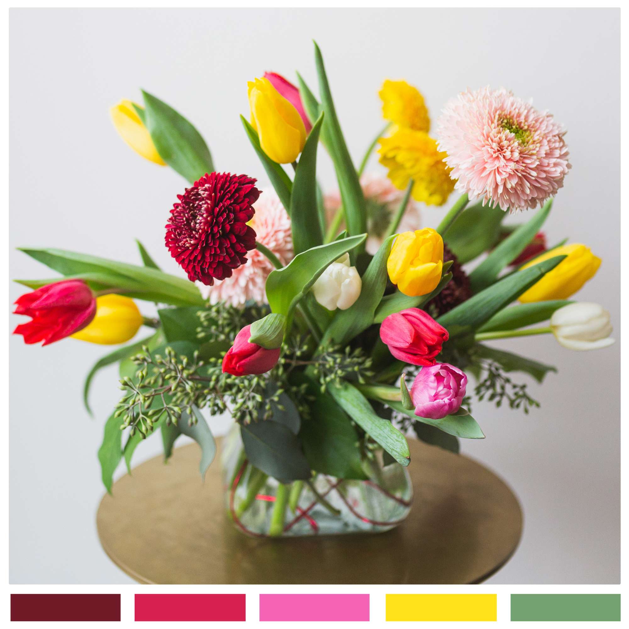 A glorious little arrangement of Gerbera daisies and tulips, gathered in a A glorious little arrangement of Gerbera daisies and tulips, gathered in a