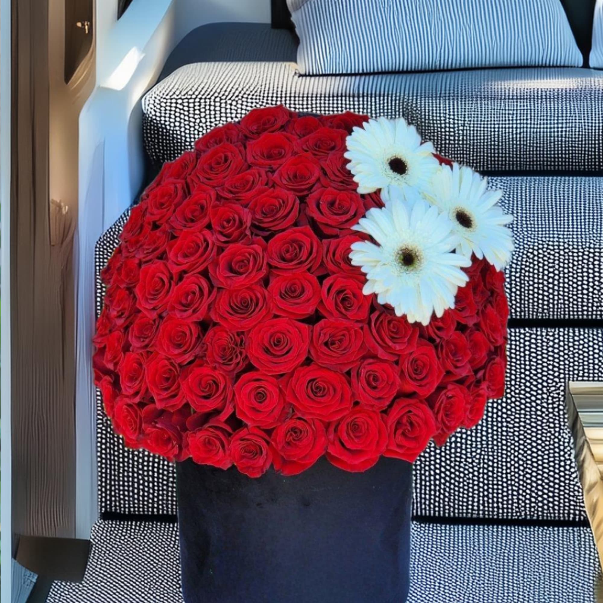 Our luxurious black box filled with stunning red roses is the perfect