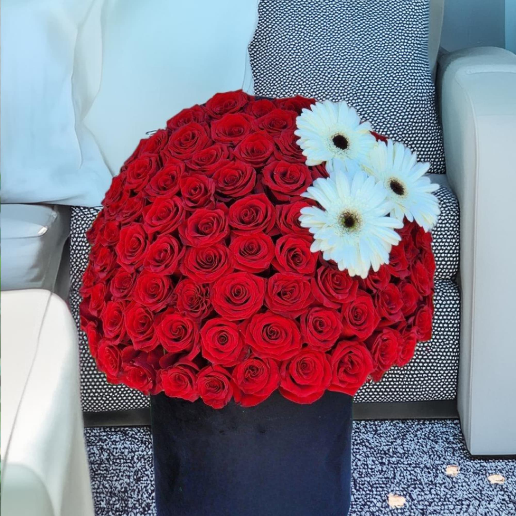 Our luxurious black box filled with stunning red roses is the perfect