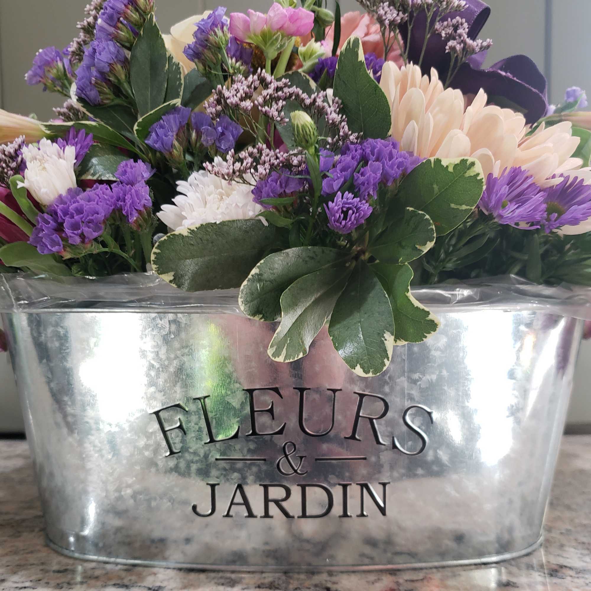 NOTE! Limited qty of containers and blush tone flowers...would substitute! 
Keepsake, oval