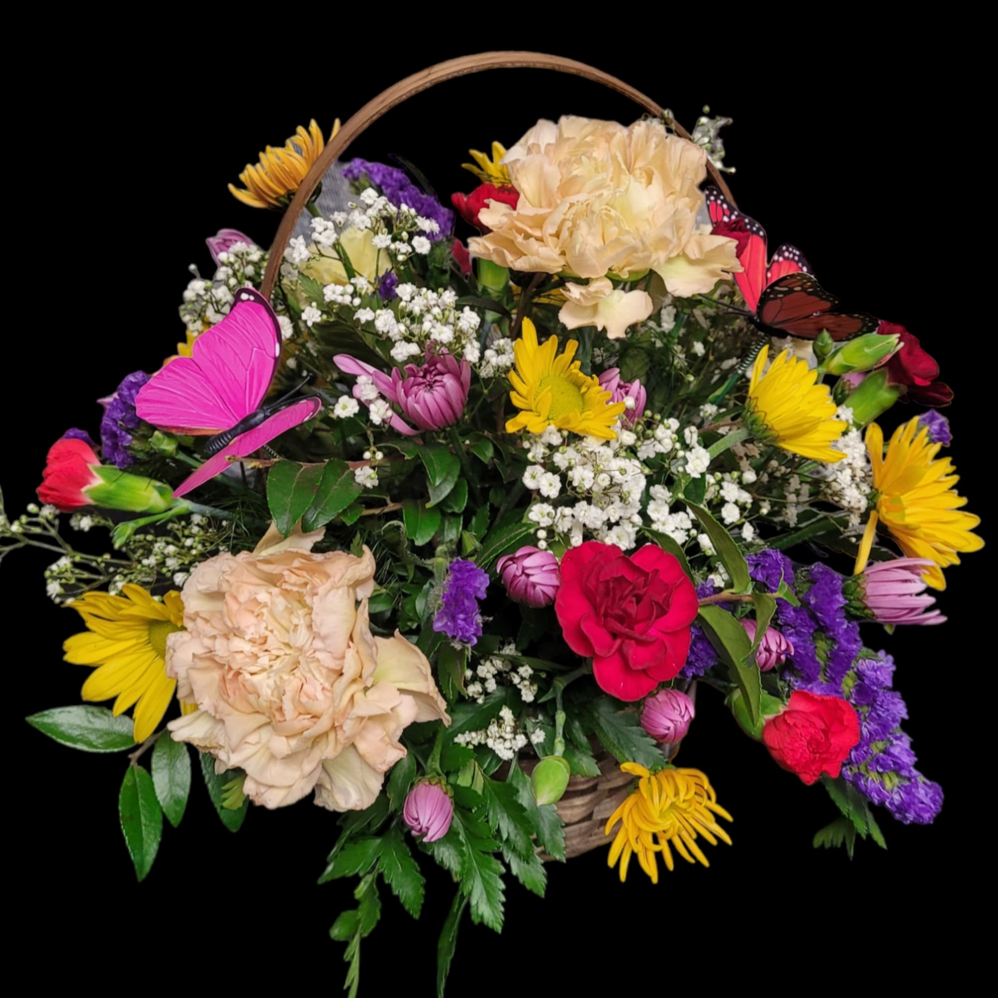 Bright and cheerful blooms arranged in a basket and topped with a